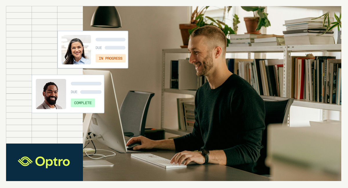A smiling man works at a computer in a modern office, with digital overlays showing project task statuses for teammates.