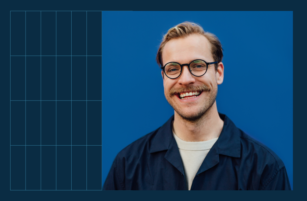 person with glasses smiling