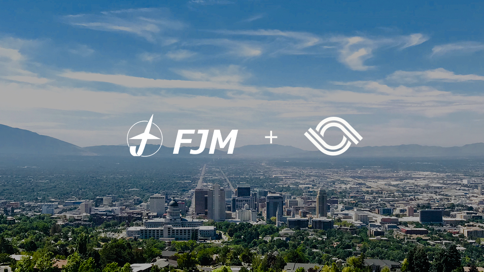 city skyline with FJM and Optro logos