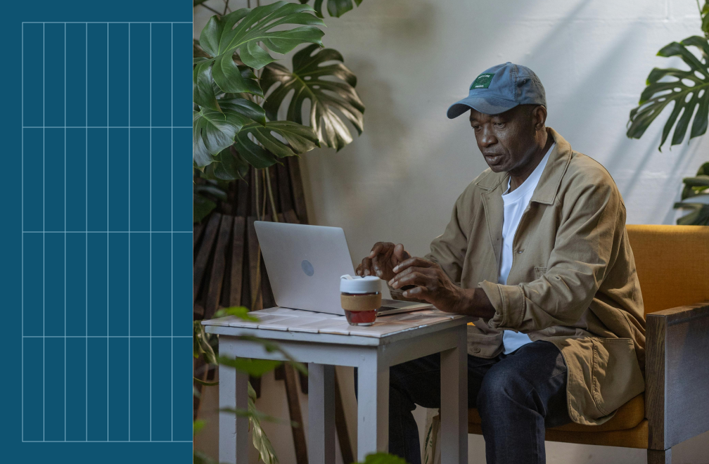 man working in cafe at laptop