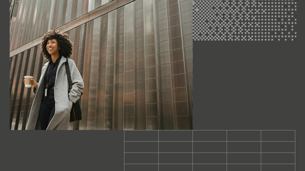 woman in a trench coat carrying coffee