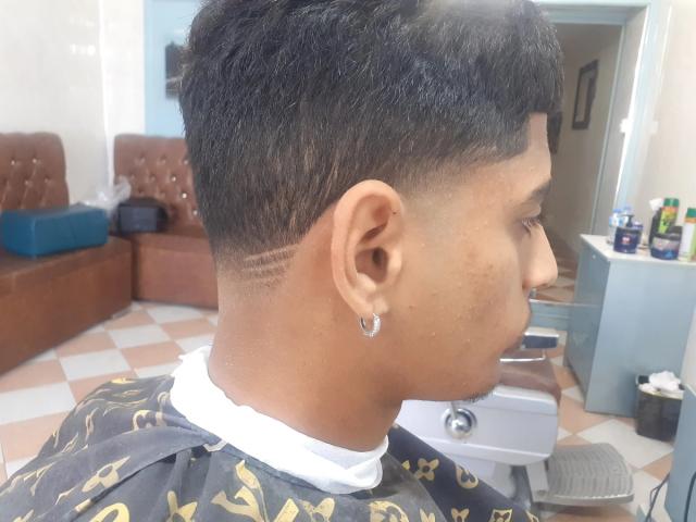 Fade seen from behind, in the chair