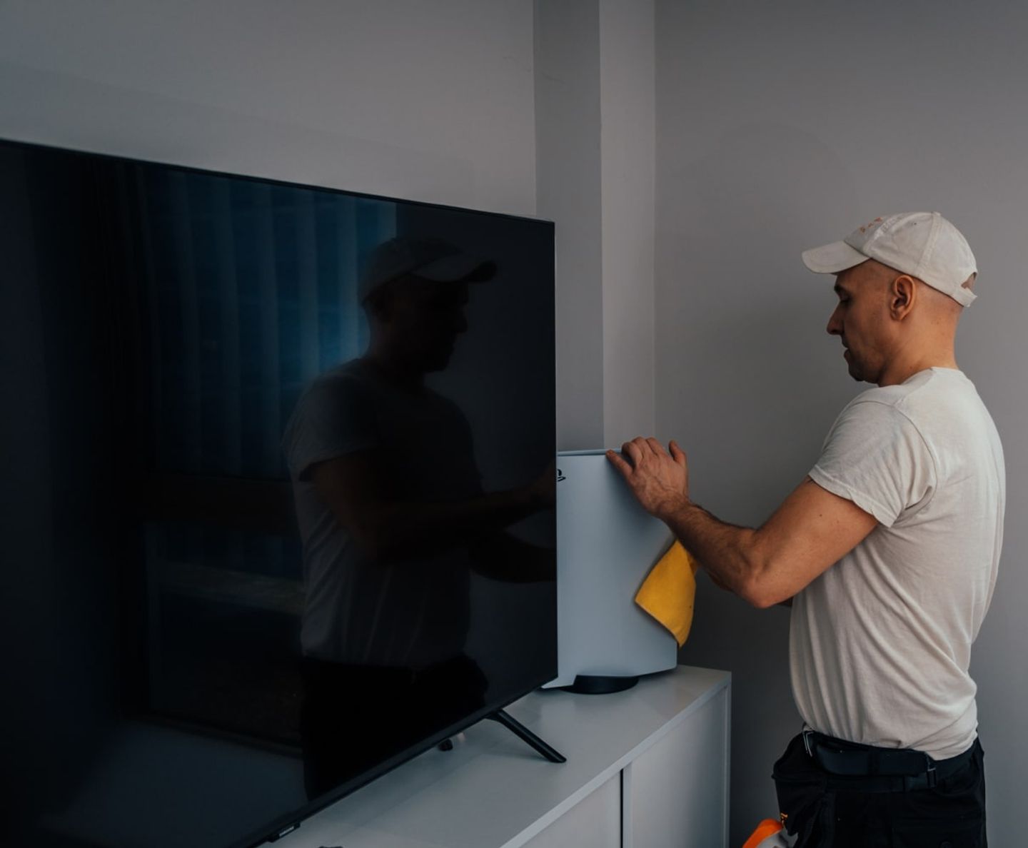 Eagle Family cleaner polishing a wall-mounted television
