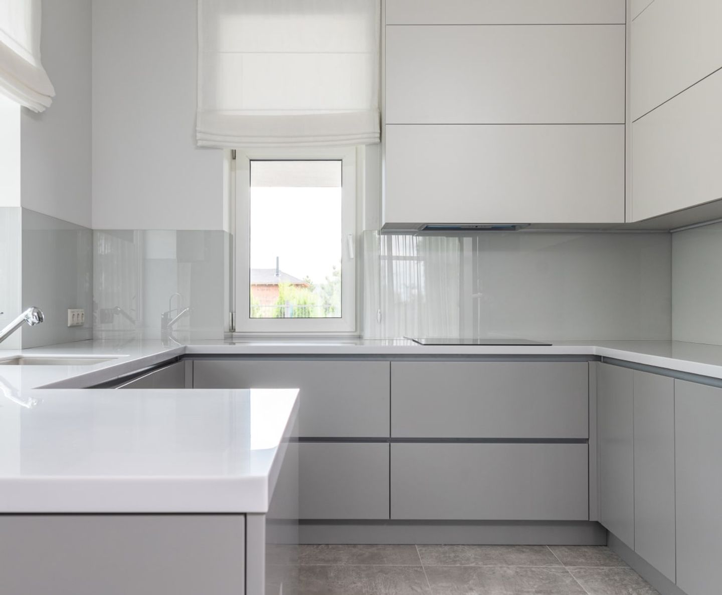 Clean minimalist grey kitchen after a professional clean