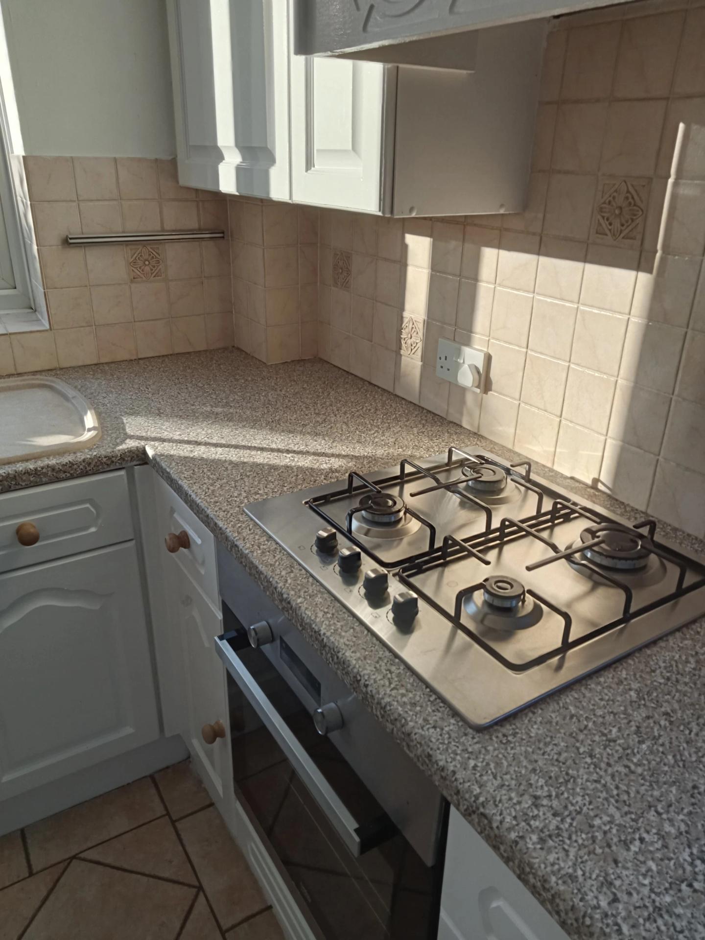 Cleaned kitchen gas hob and worktop