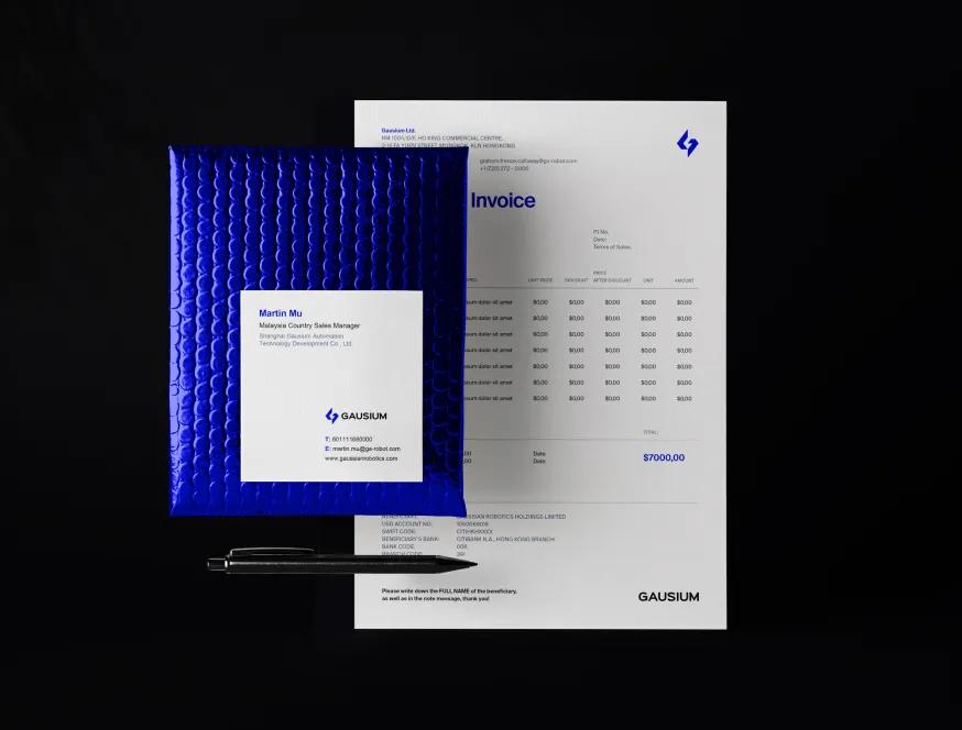 Gausium stationery: business card on a blue padded mailer, invoice and pen