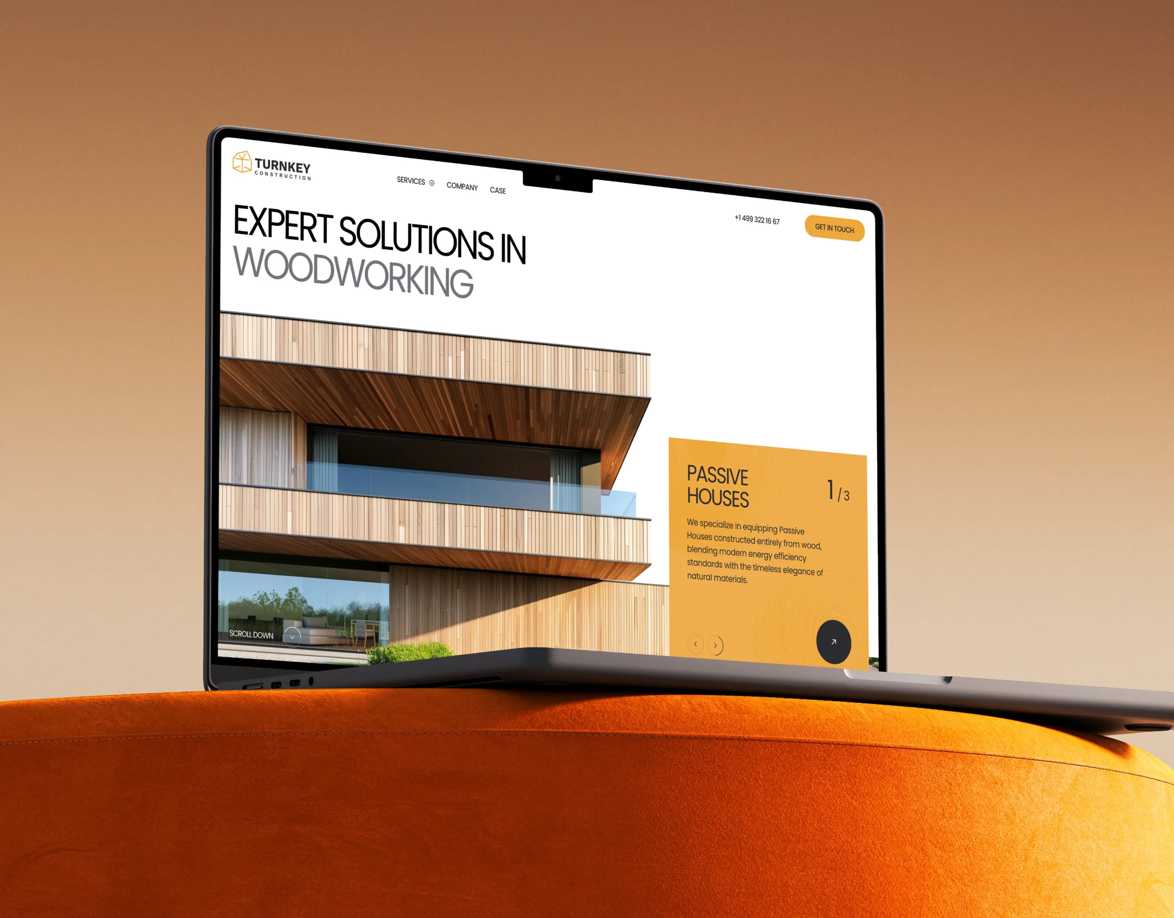 Modern website design for a woodworking company, showcasing passive house architecture on a sleek laptop screen.