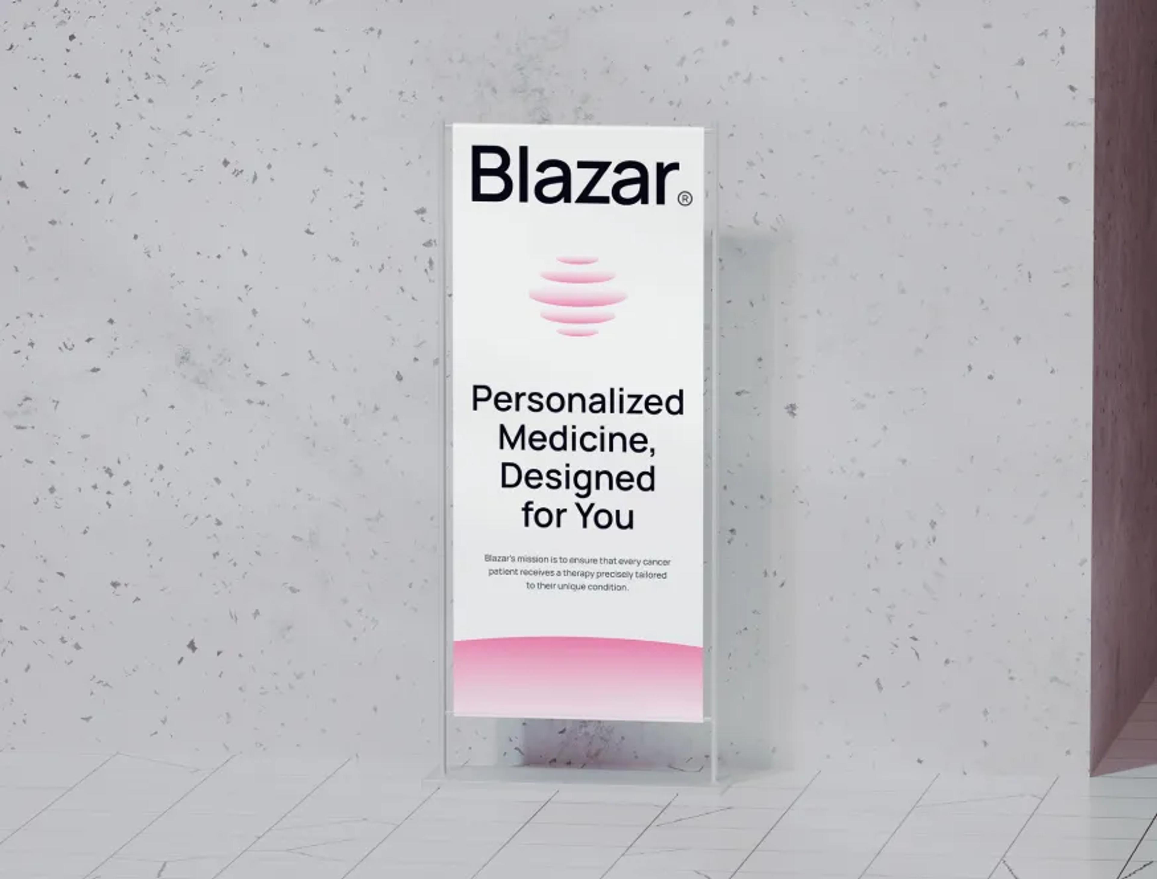 Blazar 'Personalized Medicine, Designed for You' poster in a glass stand on terrazzo