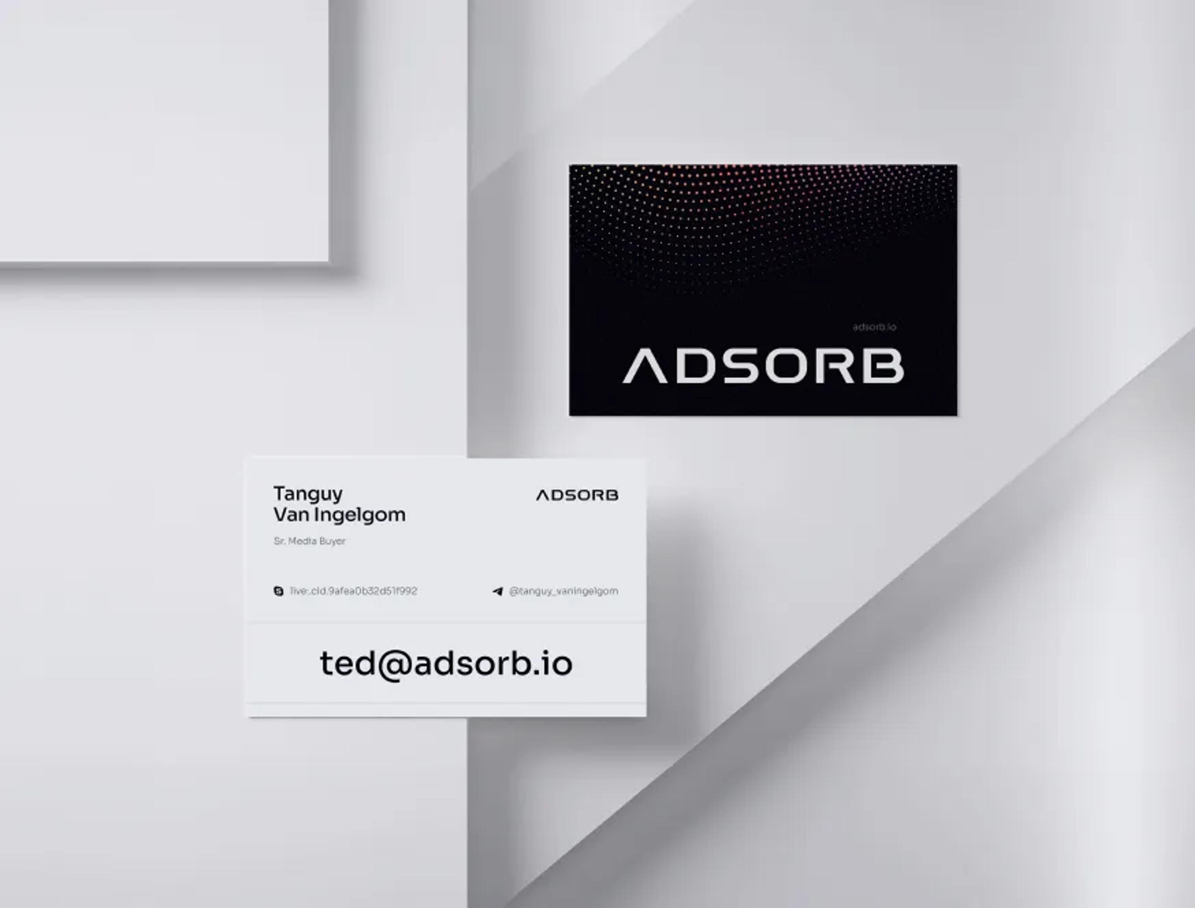 Adsorb business cards for Tanguy Van Ingelgom on a white surface