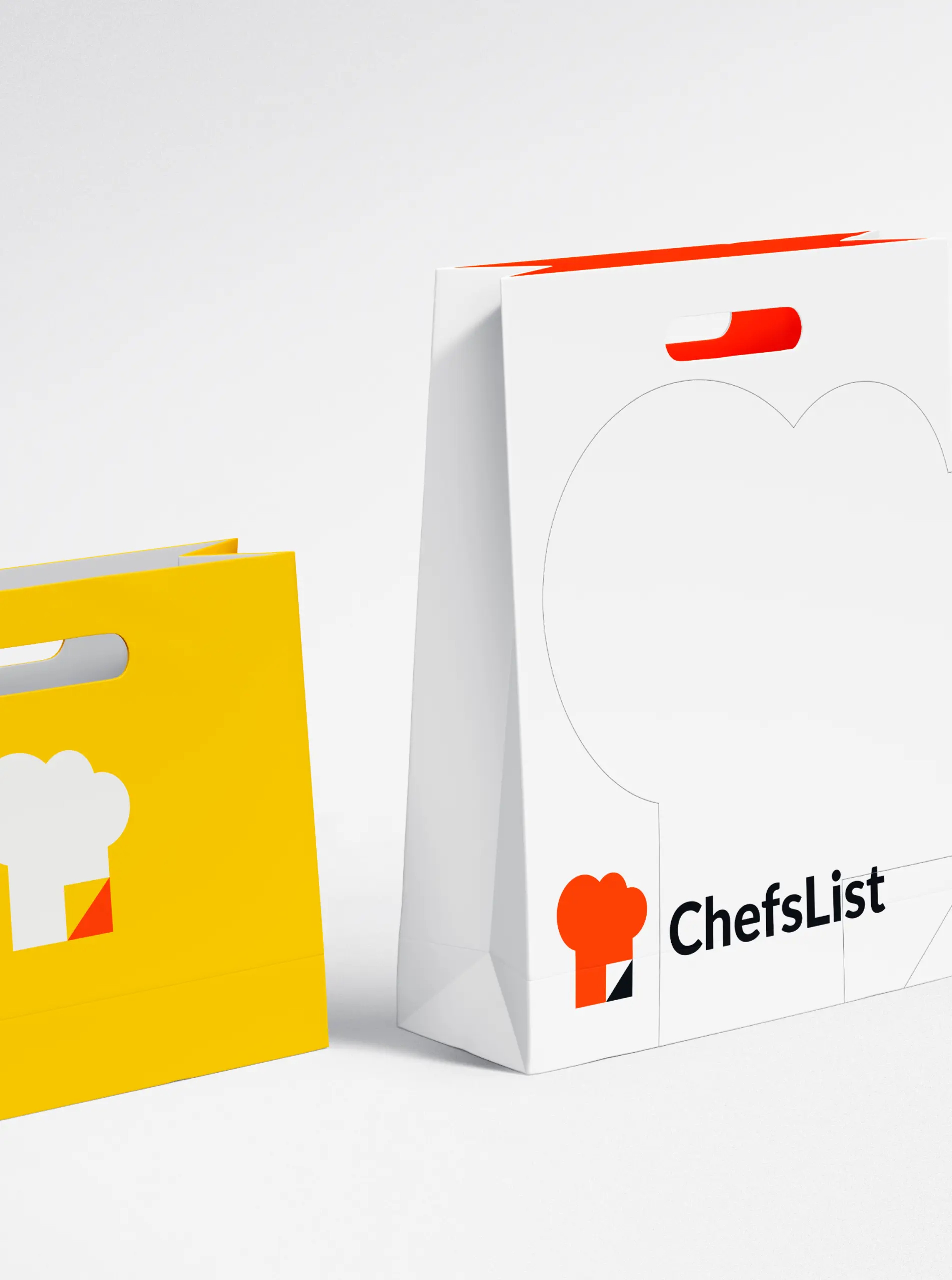 ChefsList branded shopping bags in yellow and white with the chef hat logo