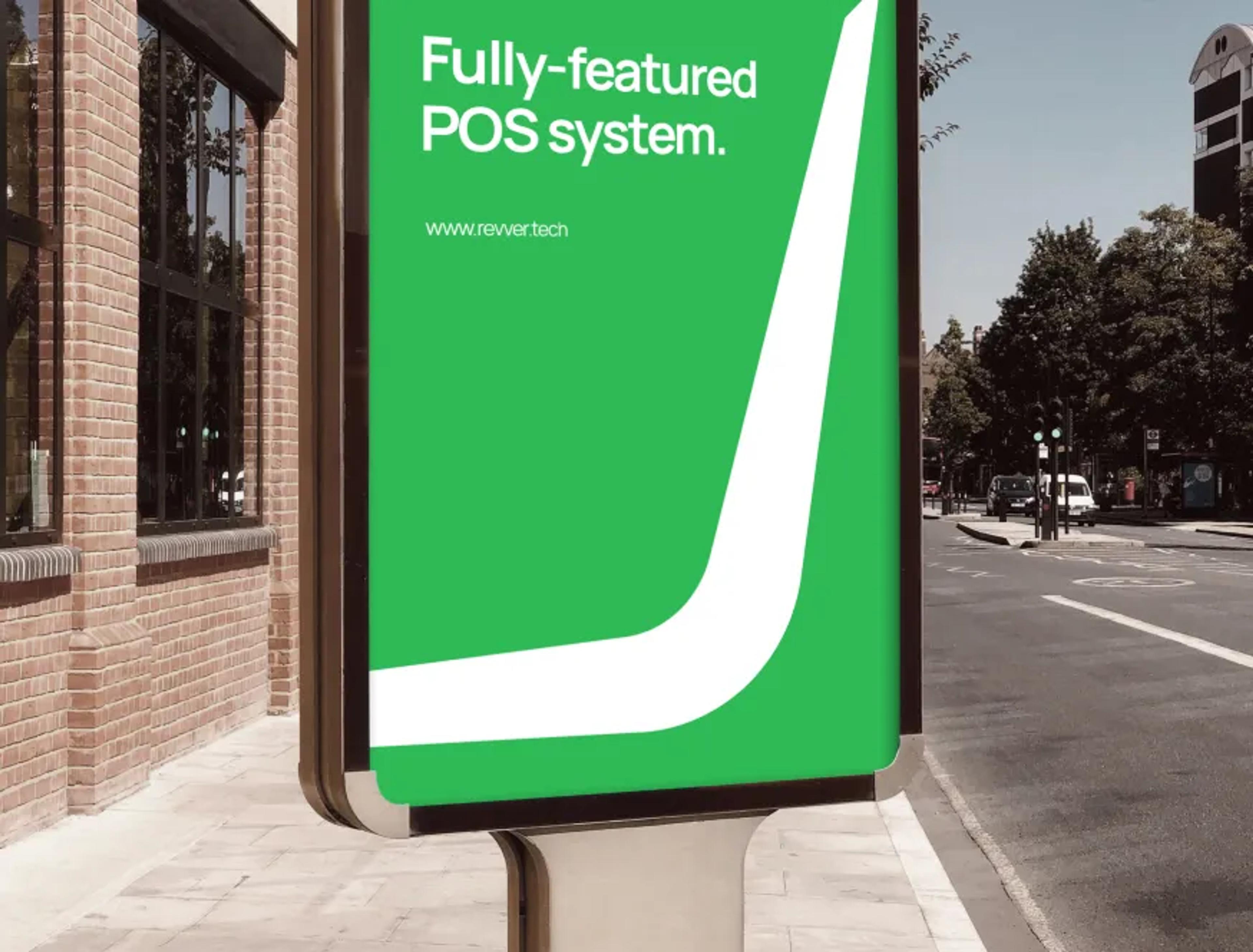 Revver 'Fully-featured POS system' poster on a city street billboard