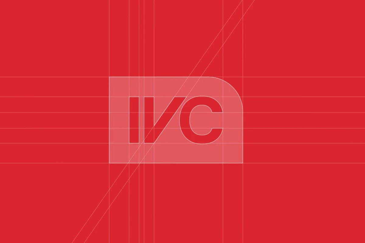 Logo construction grid of a bold red monogram "IVC" with geometric guides on a red background.