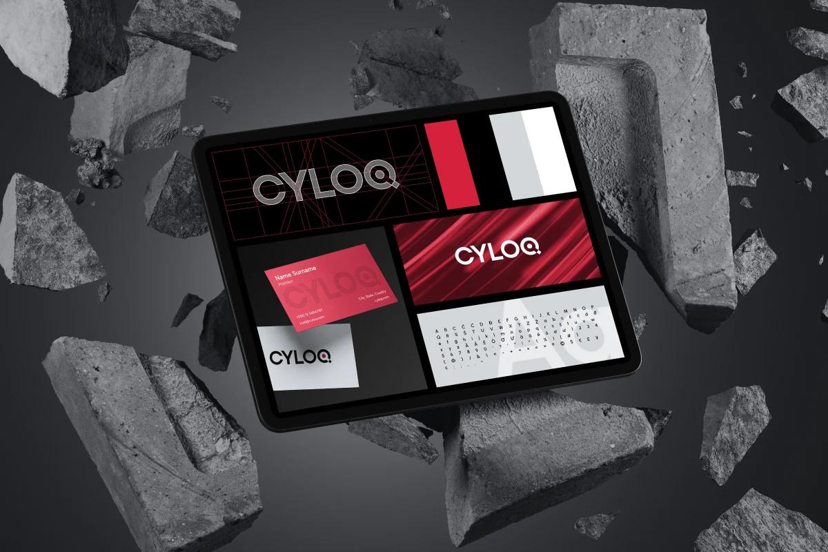 Branding presentation for CYLOQ on a tablet surrounded by floating concrete blocks, showcasing logo, typography, and color palette in a bold, futuristic style.