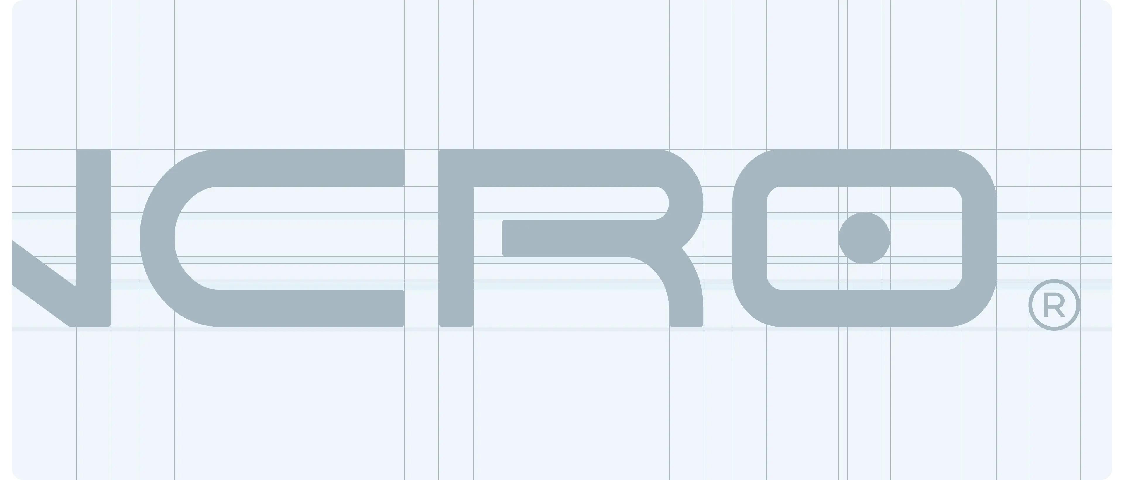 Close-up of the Emancro wordmark on a construction grid