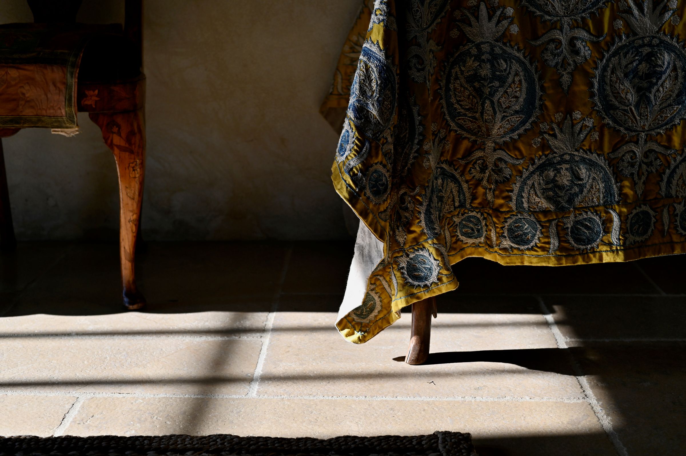 fabric skimming the floor in the sunlight