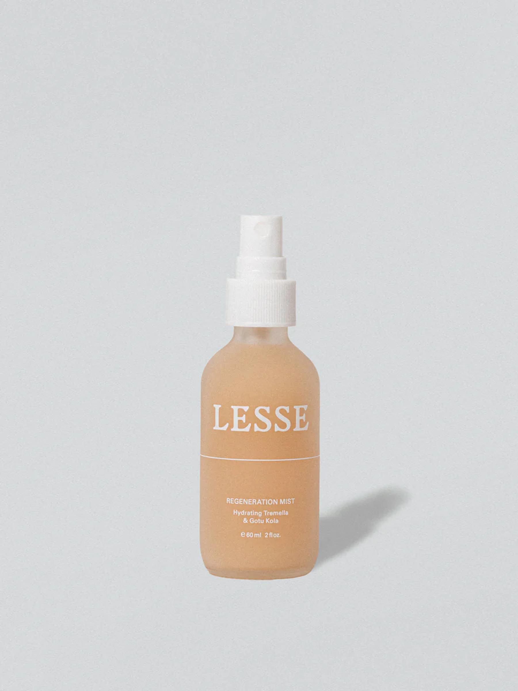 LESSE Regeneration Mist bottle on grey background. Label details product info. Minimalist design showcases organic skincare.