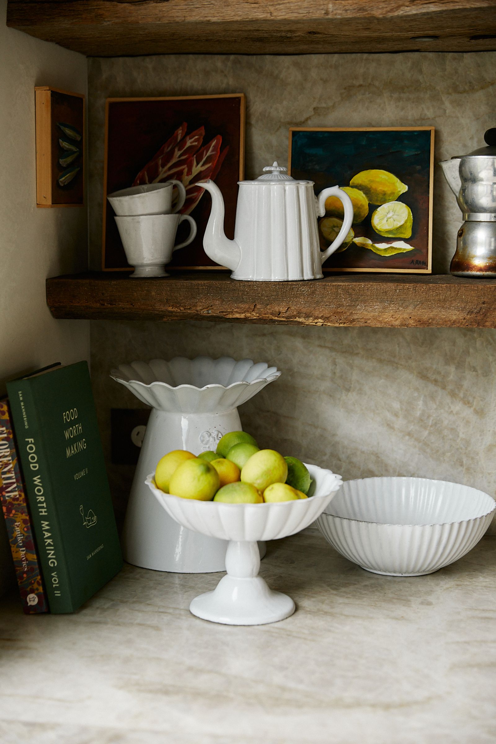 kitchen bench and shelving feature Astier de Villatte stands, bowl and teapot