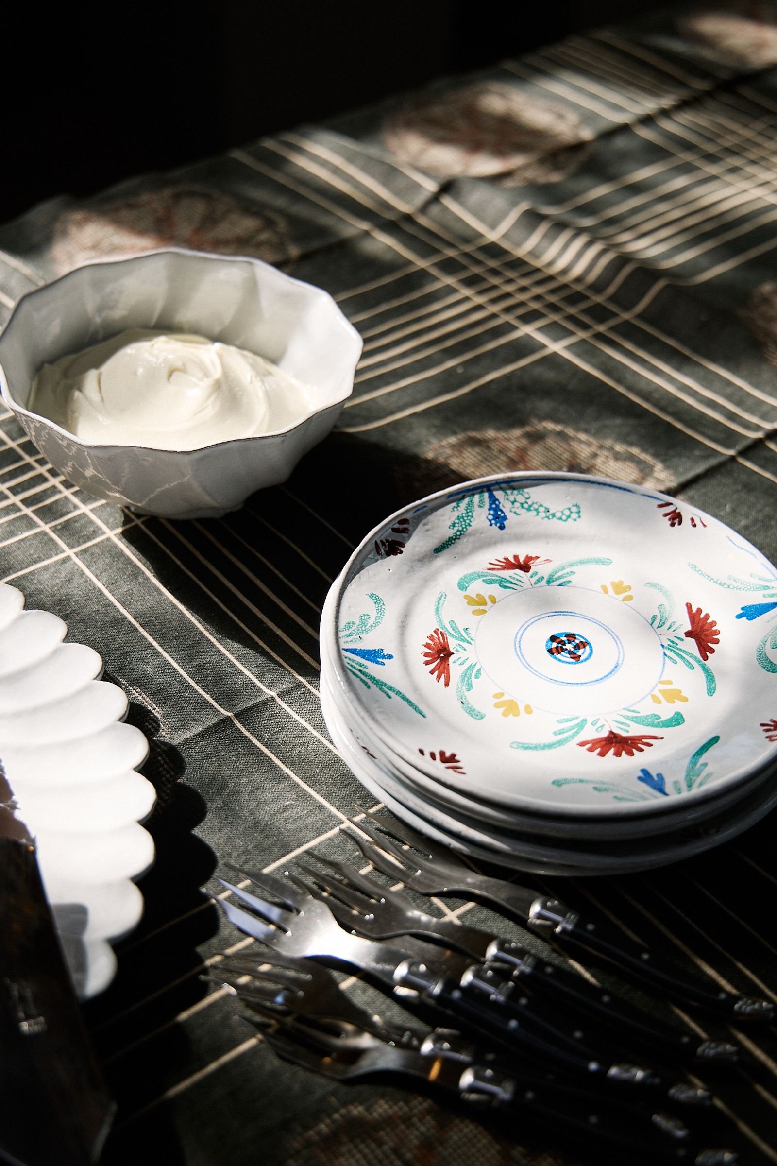 painted ceramic plates stacked on the table