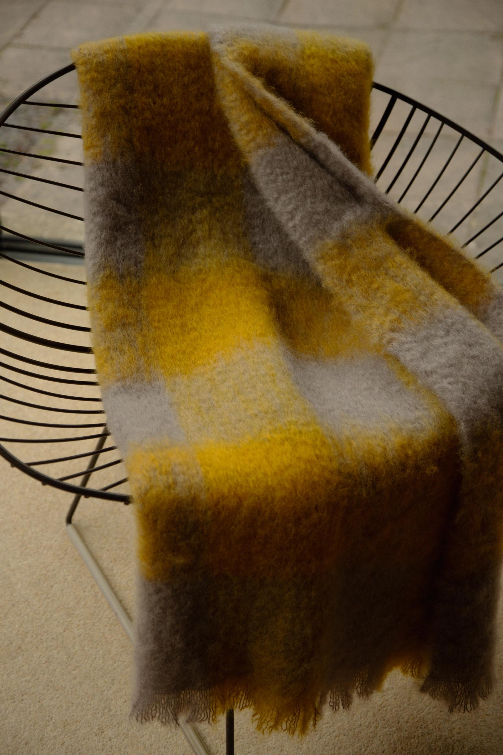 interior of a dining room with blanket thrown over dining chair