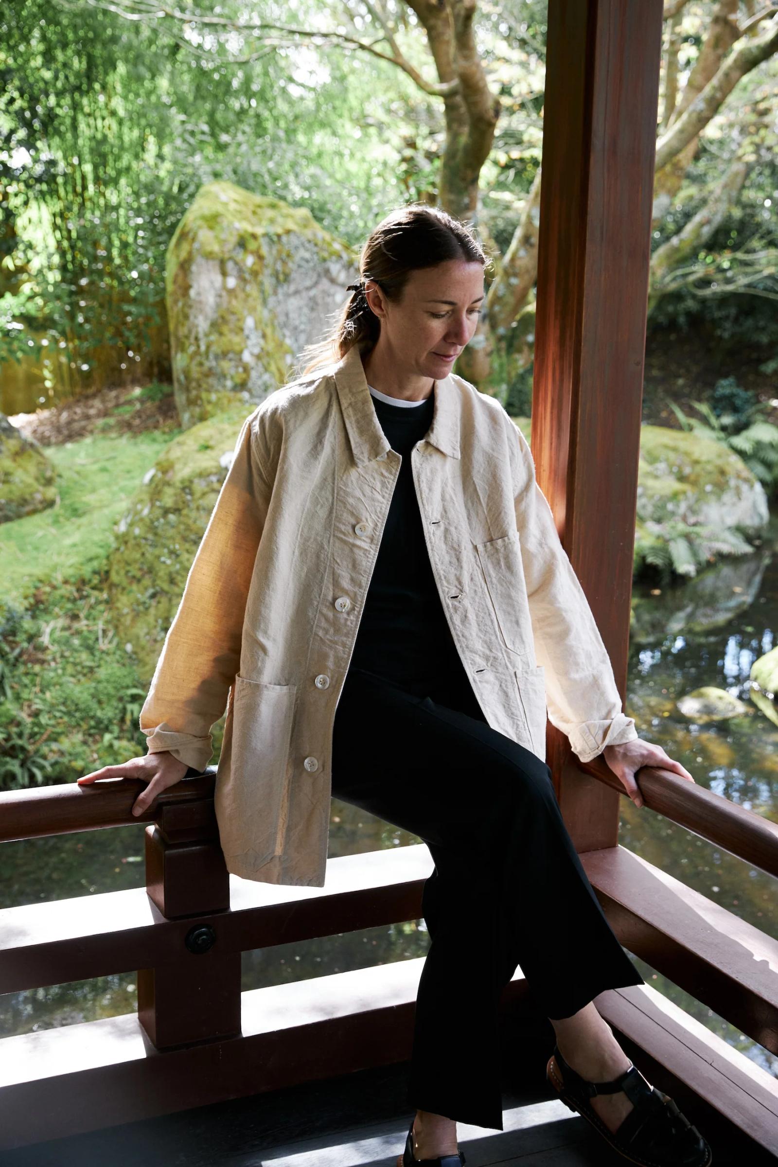 3 Pocket Jacket in cream cotton worn open and unbuttoned.