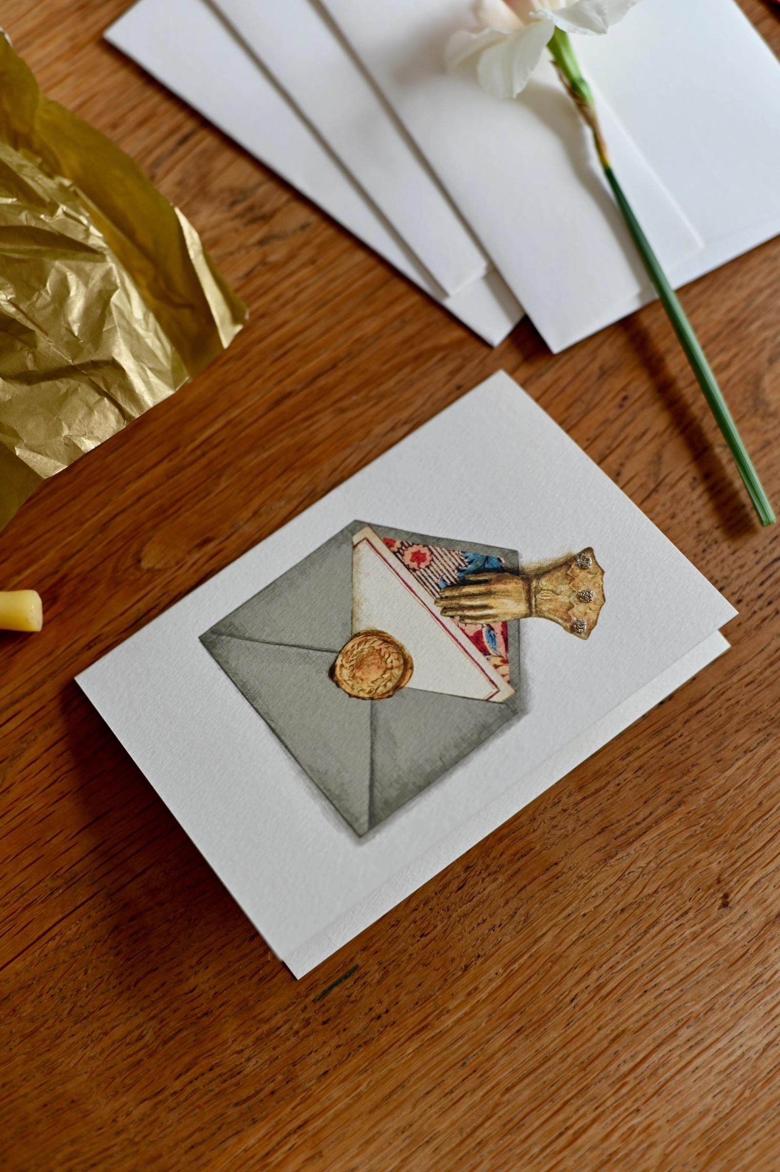 Handmade card on table with flower