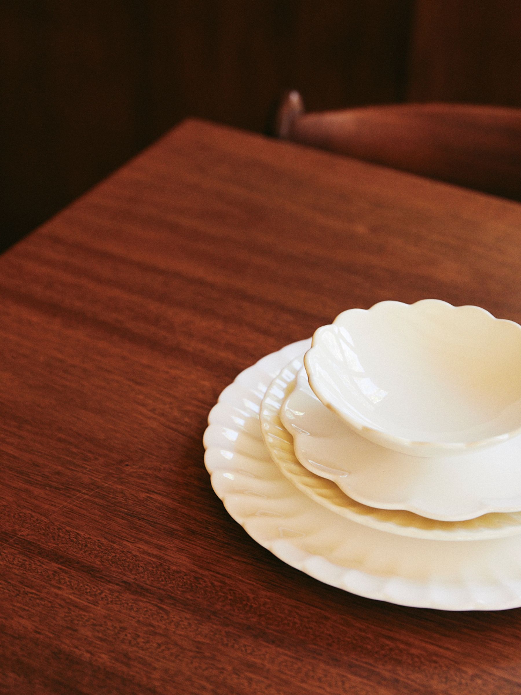 Rachel Carley Sunflower Plate and Bowls on dark timber table