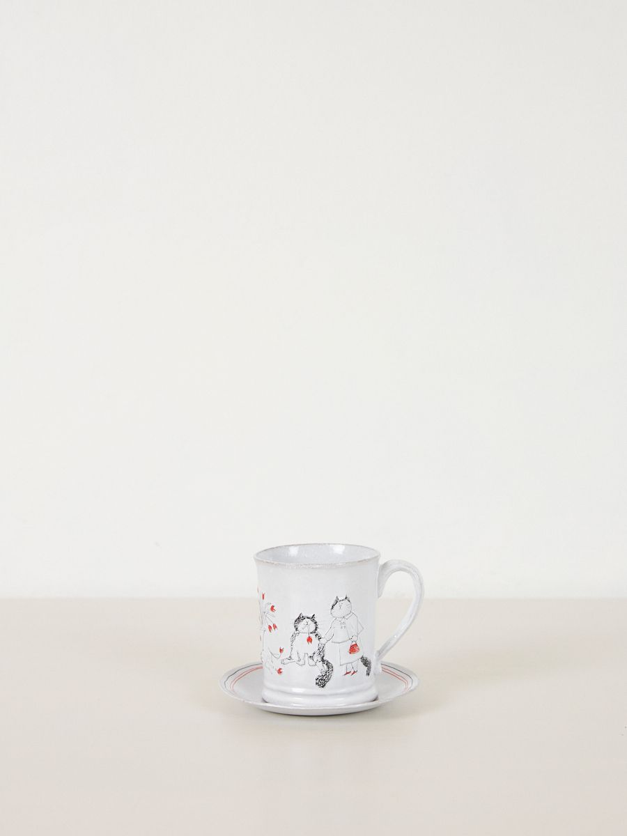 illustrated cats and flowers on ceramic tea cups 