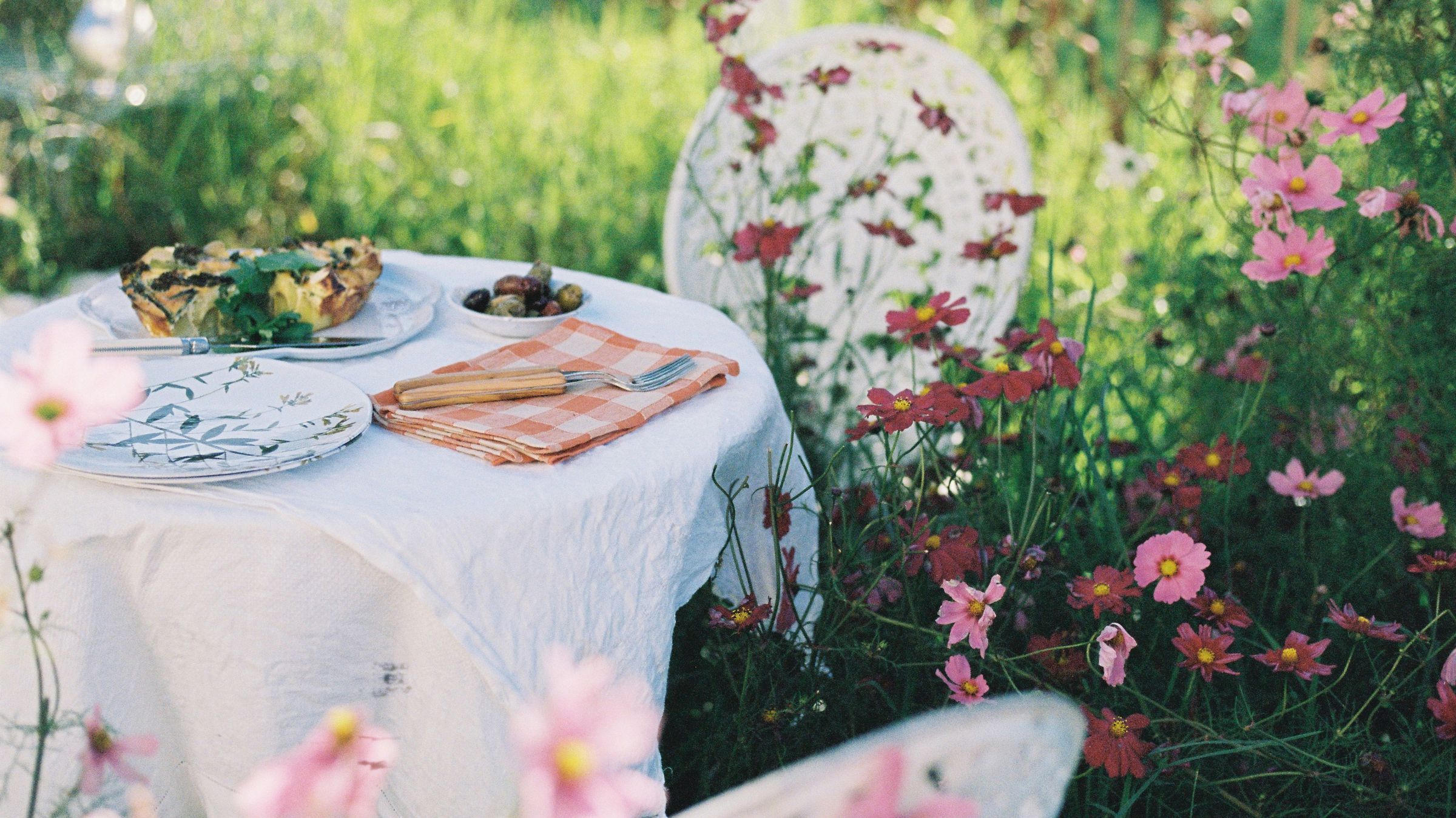 Outdoor table setting in a flower garden