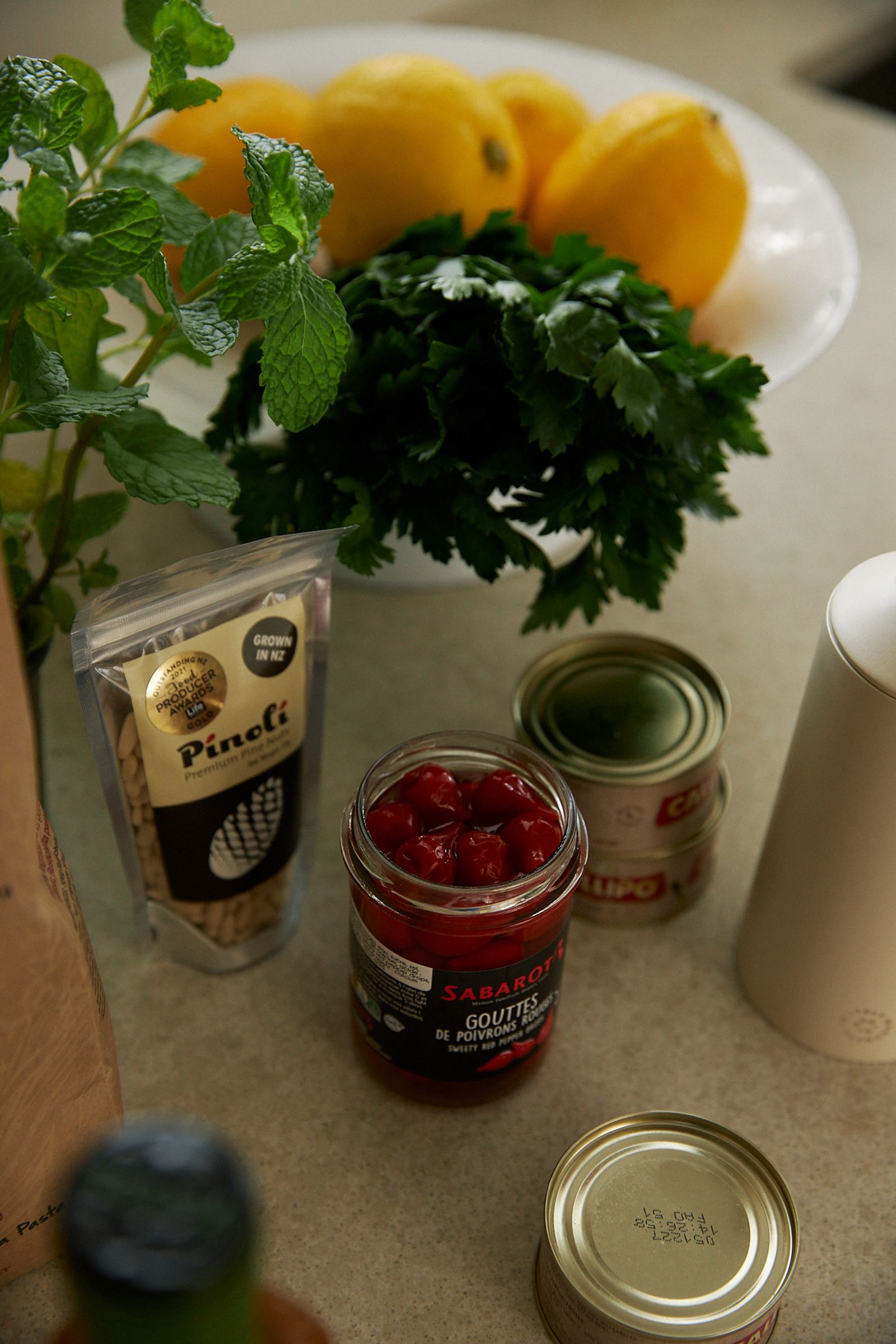 Kitchen bench piled with fresh ingredients for a summer salad