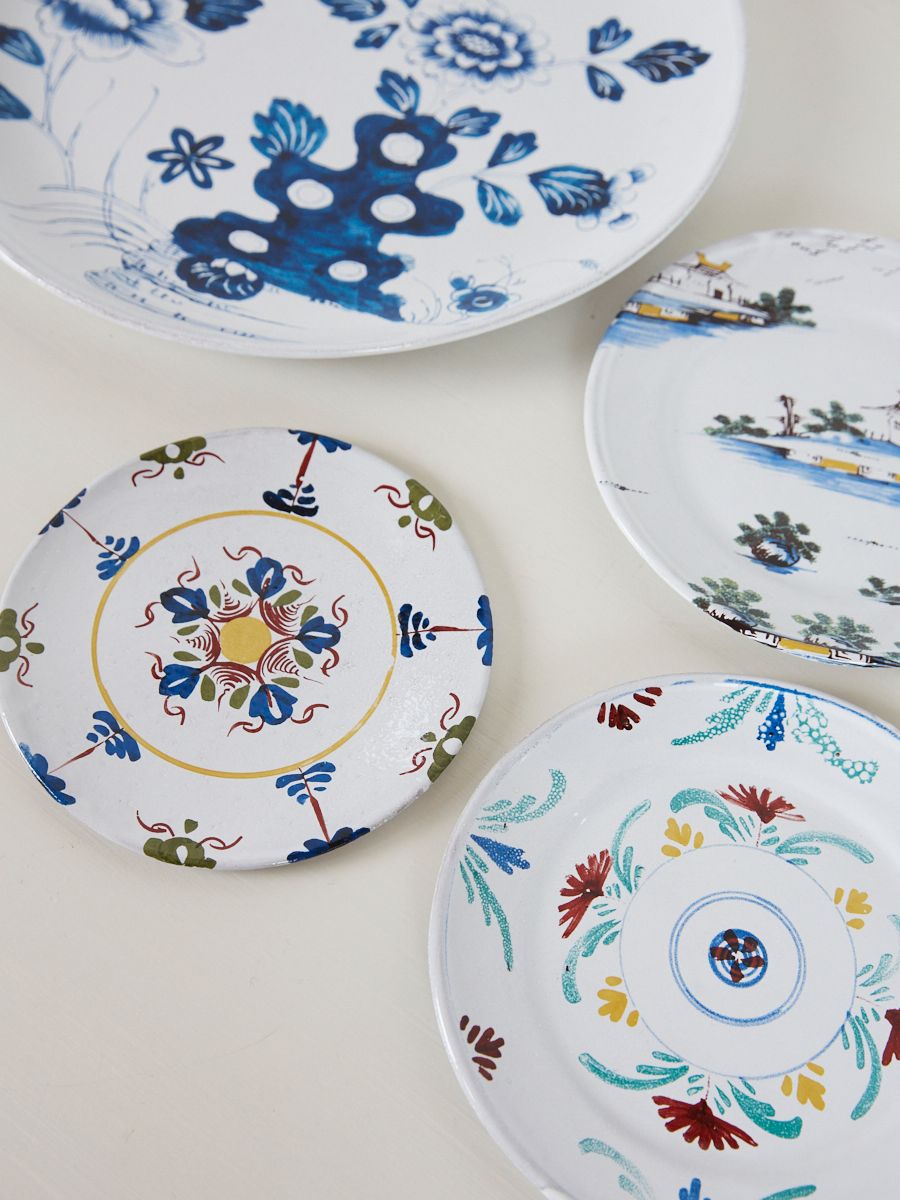 four bright hand painted plates 