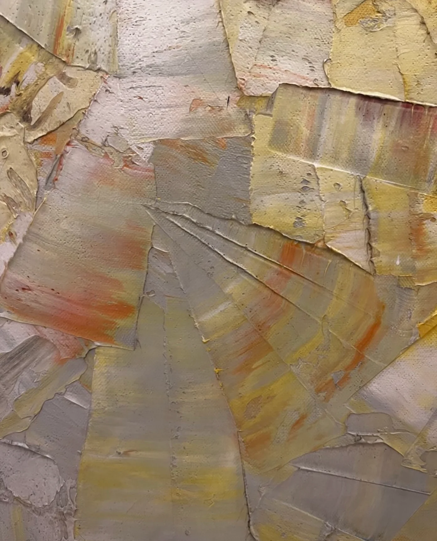 Abstract painting with yellow, orange, and grey layers. Fragmented surface with blending patterns.