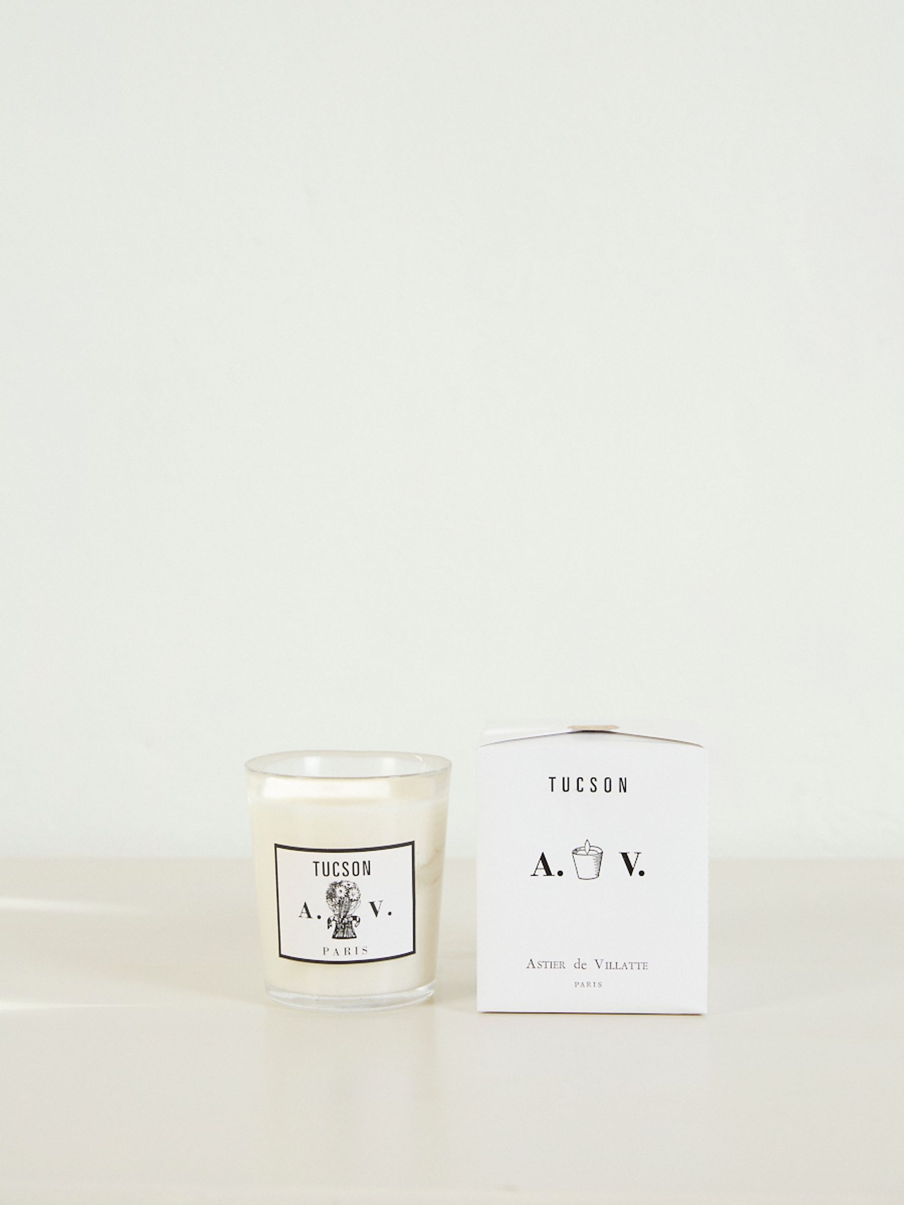 Tucson Sented Candlei. Light-colored surface, white background.