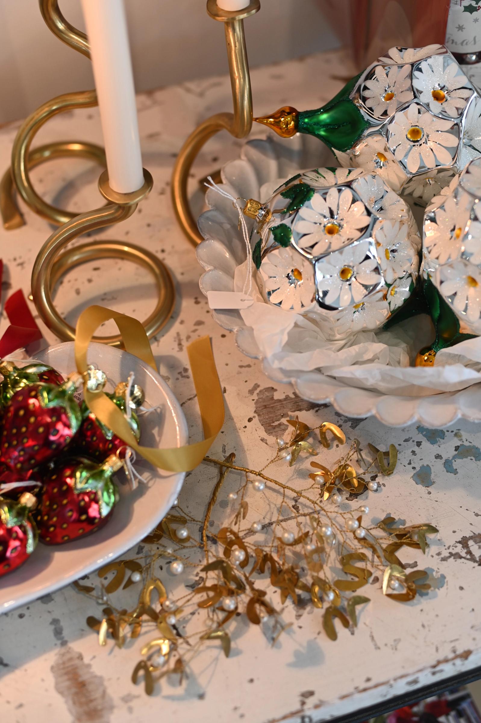 close up of decorations, mistletoe, and candlesticks