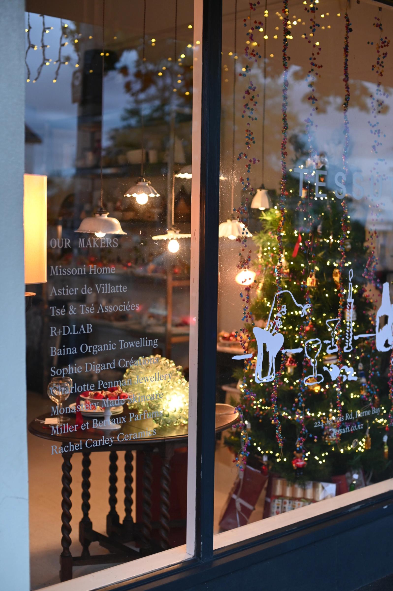 night falls and the store starts to glow with fairy lights