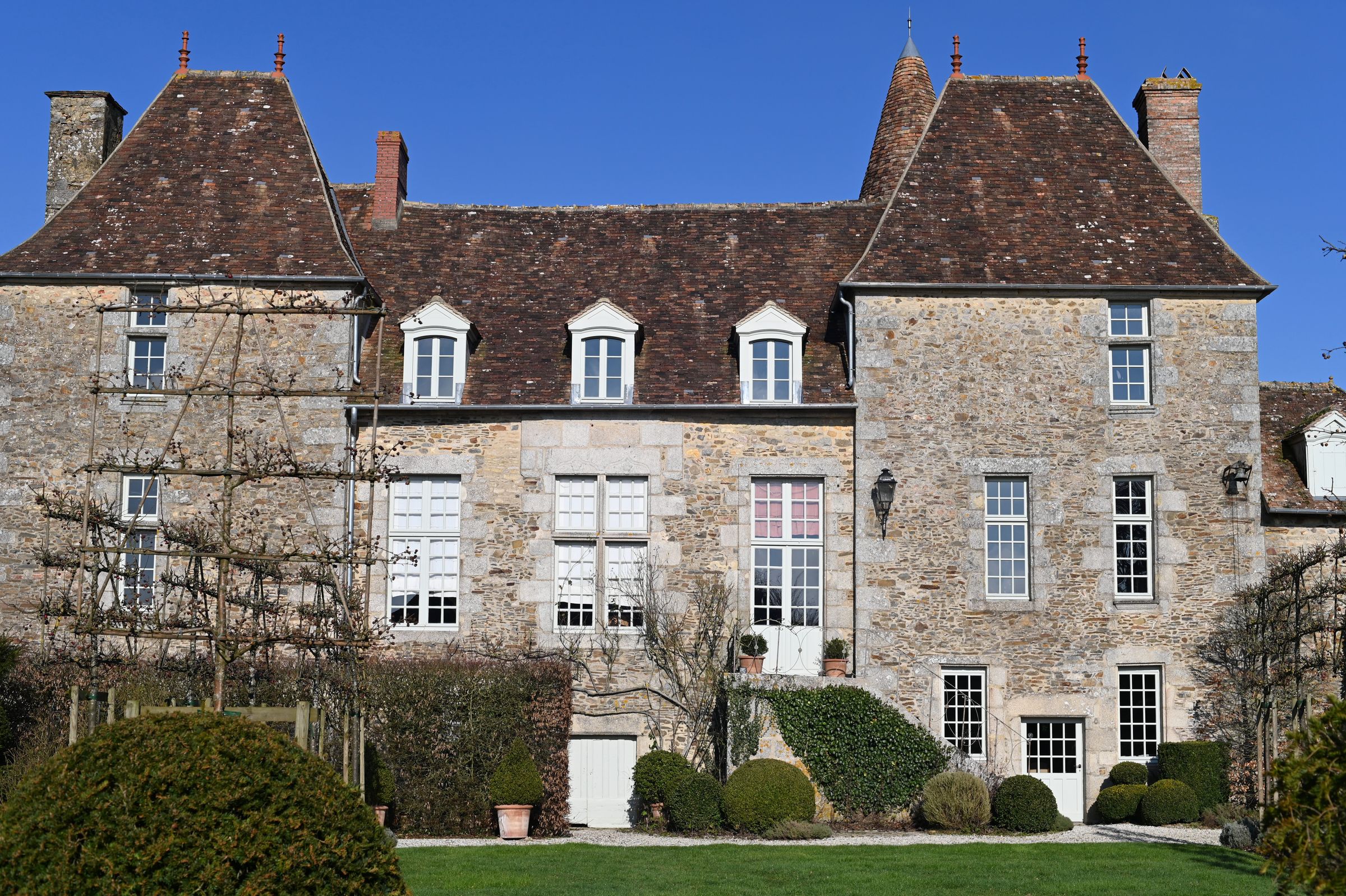 the chateau in the winter sun photographed from the garden