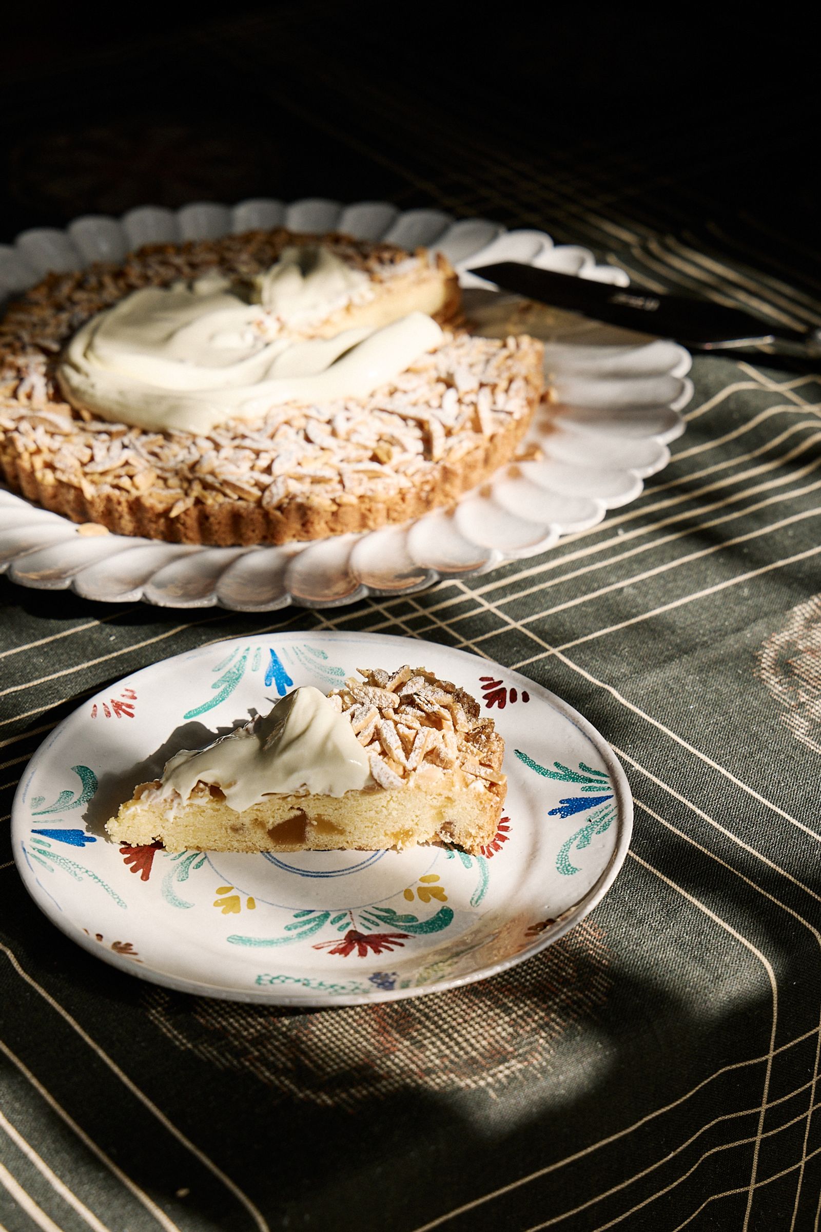 cake topped with yoghurt on a painted dessert plate 
