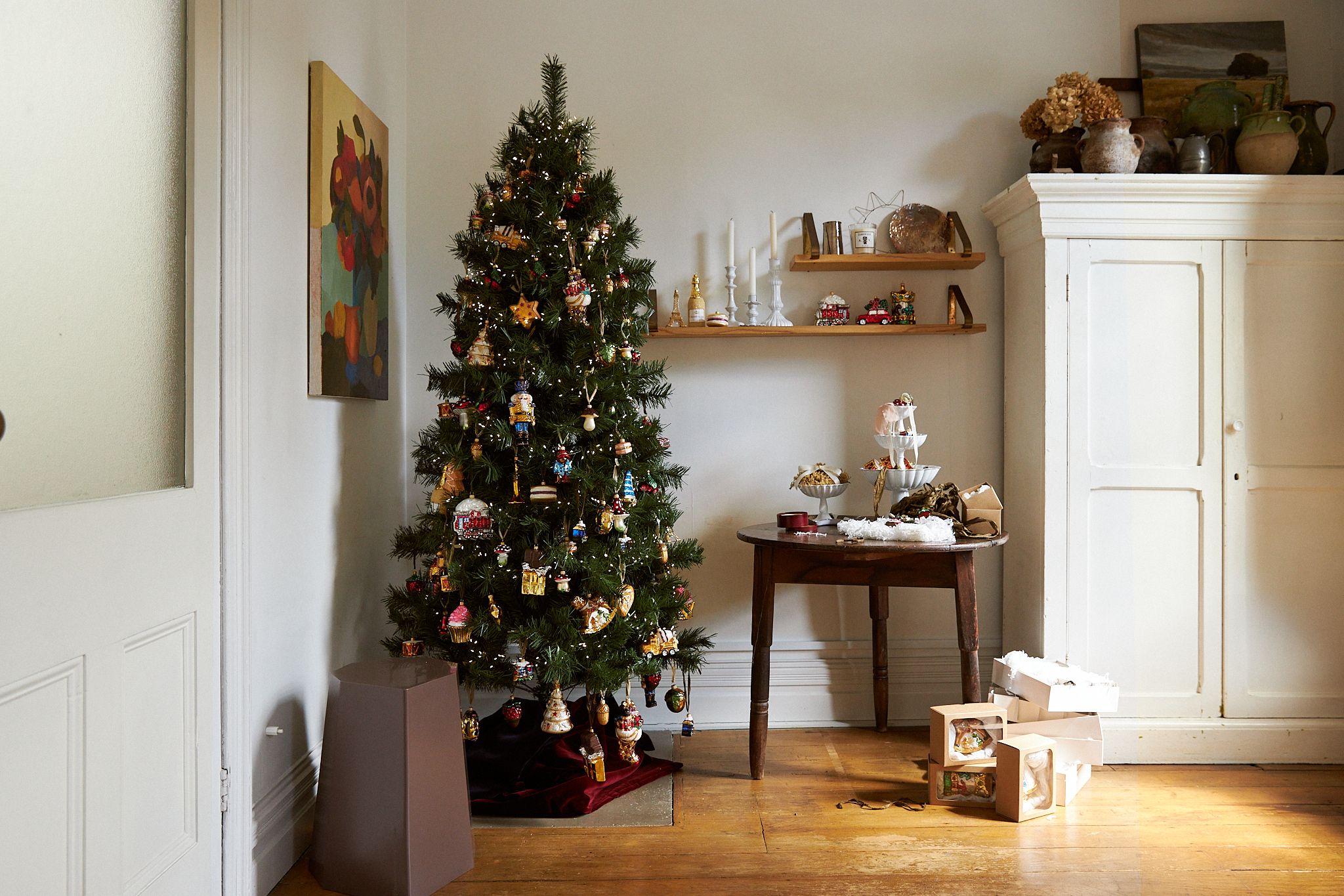 A wide shot of Ali's apartment and Christmas tree set up