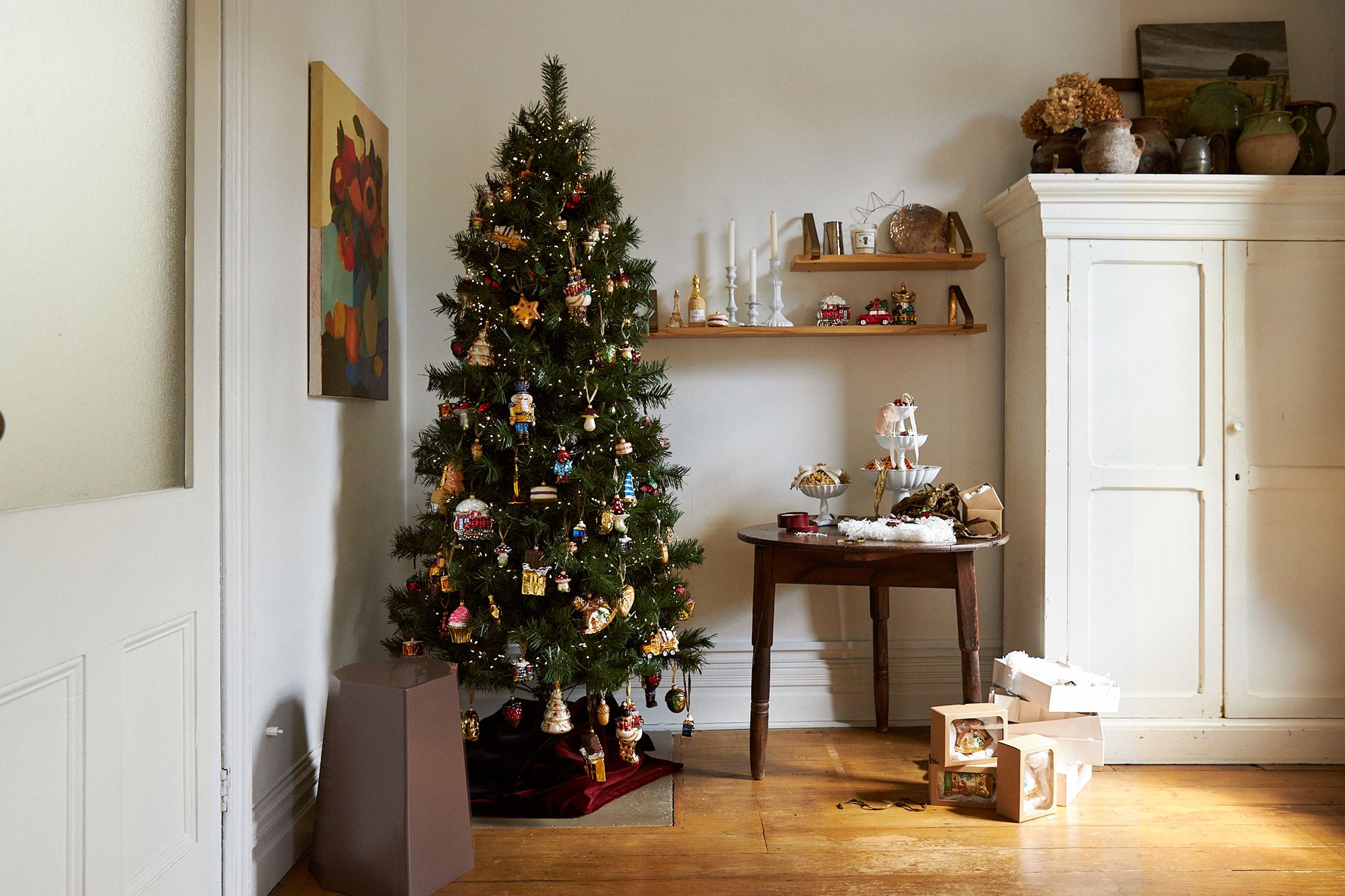 A wide shot of Ali's apartment and Christmas tree set up