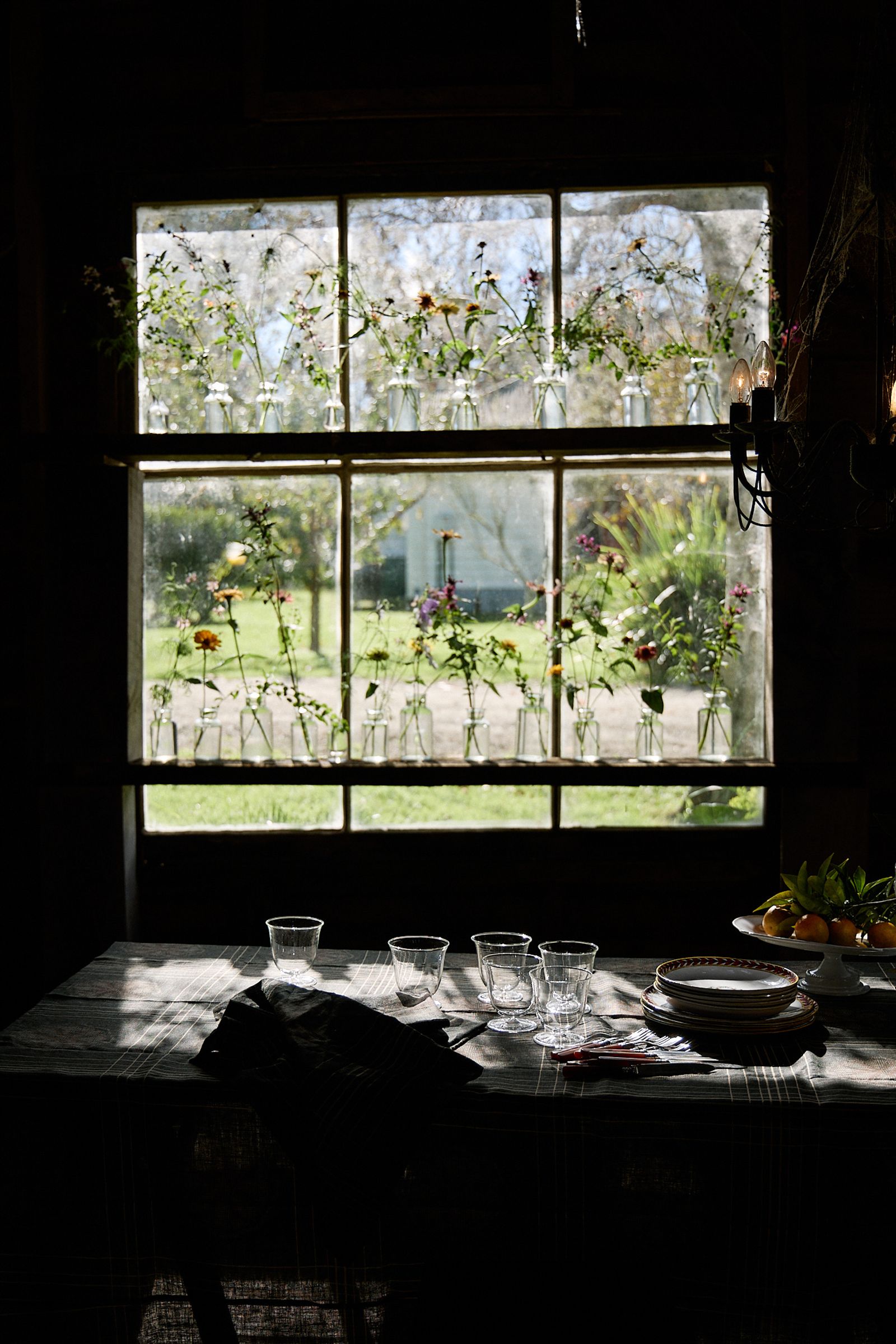 whole room shot of table against the window set with glassware