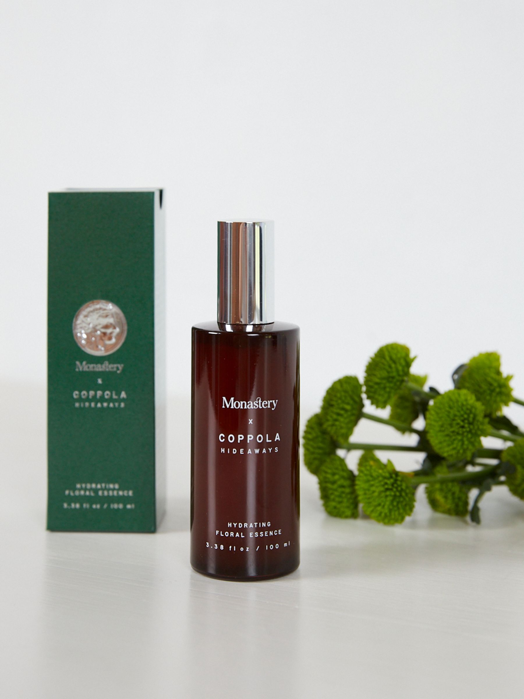 Monastery skincare green box and brown glass bottle