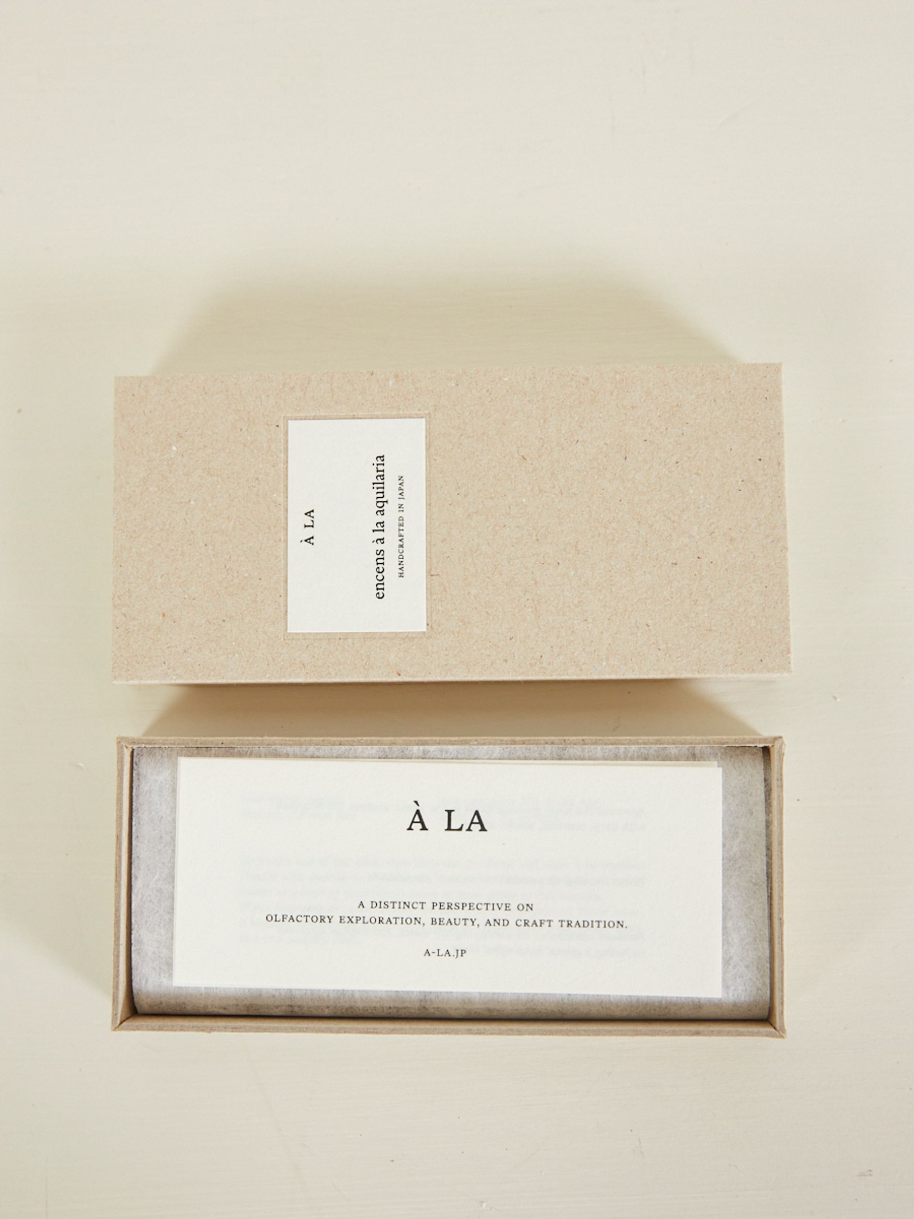 a box of incense is open on the table