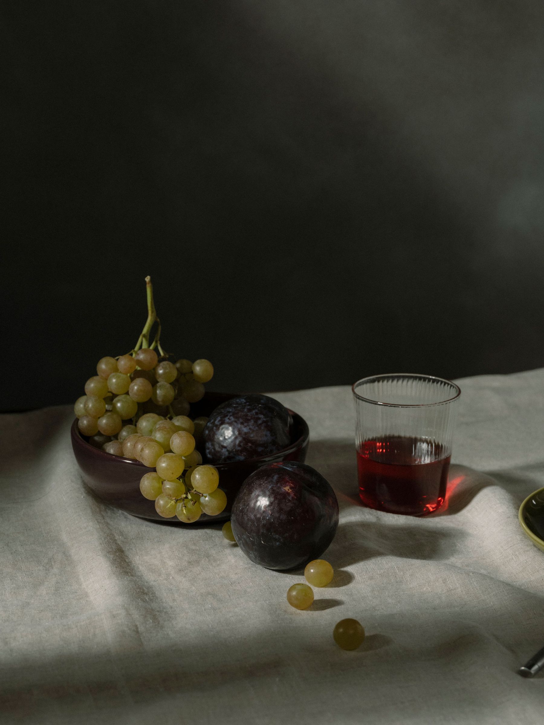 Still life on tabletop with a single glass of wine