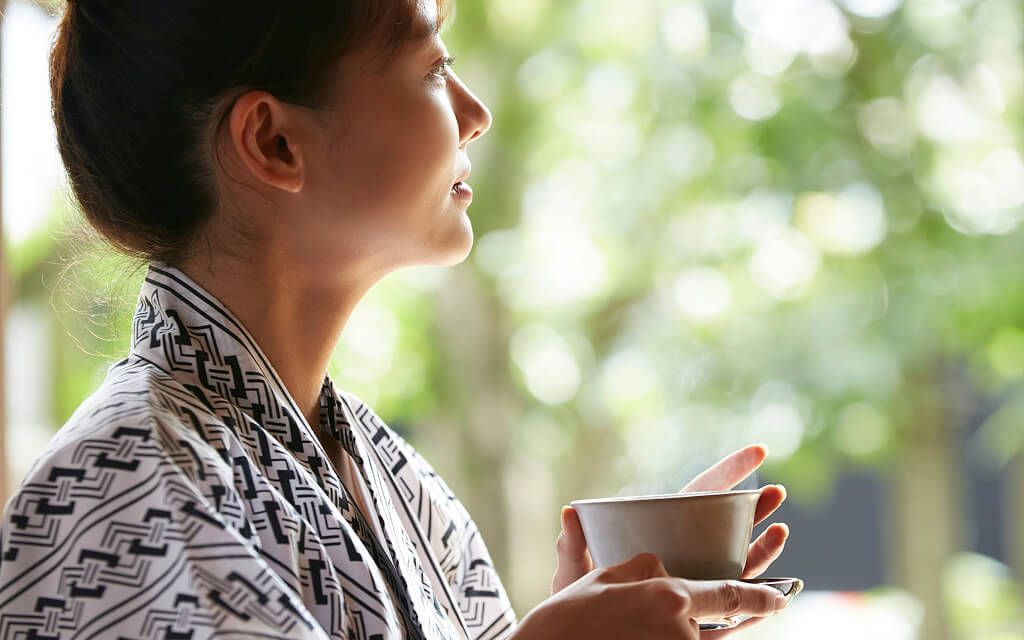 A person drinking tea