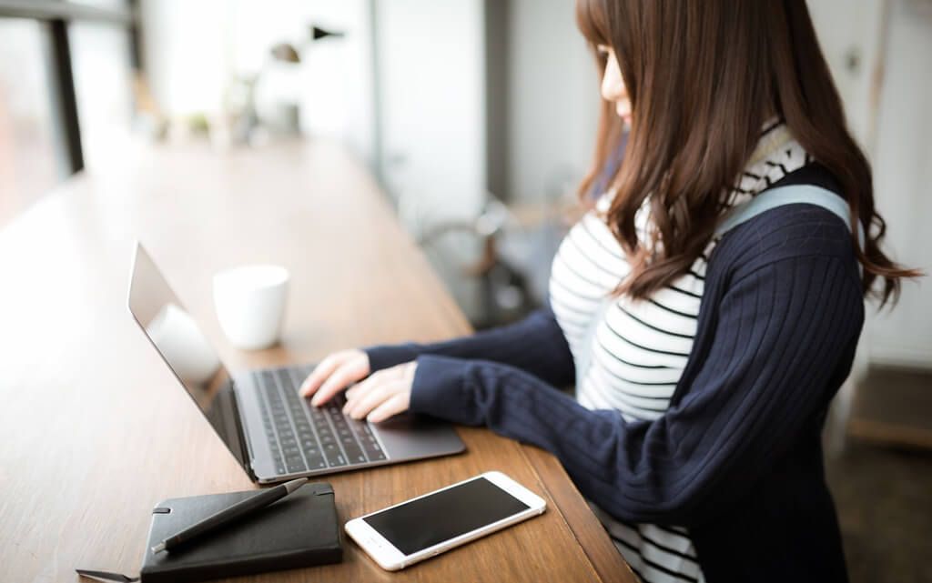 Girl working in a wifi cafe