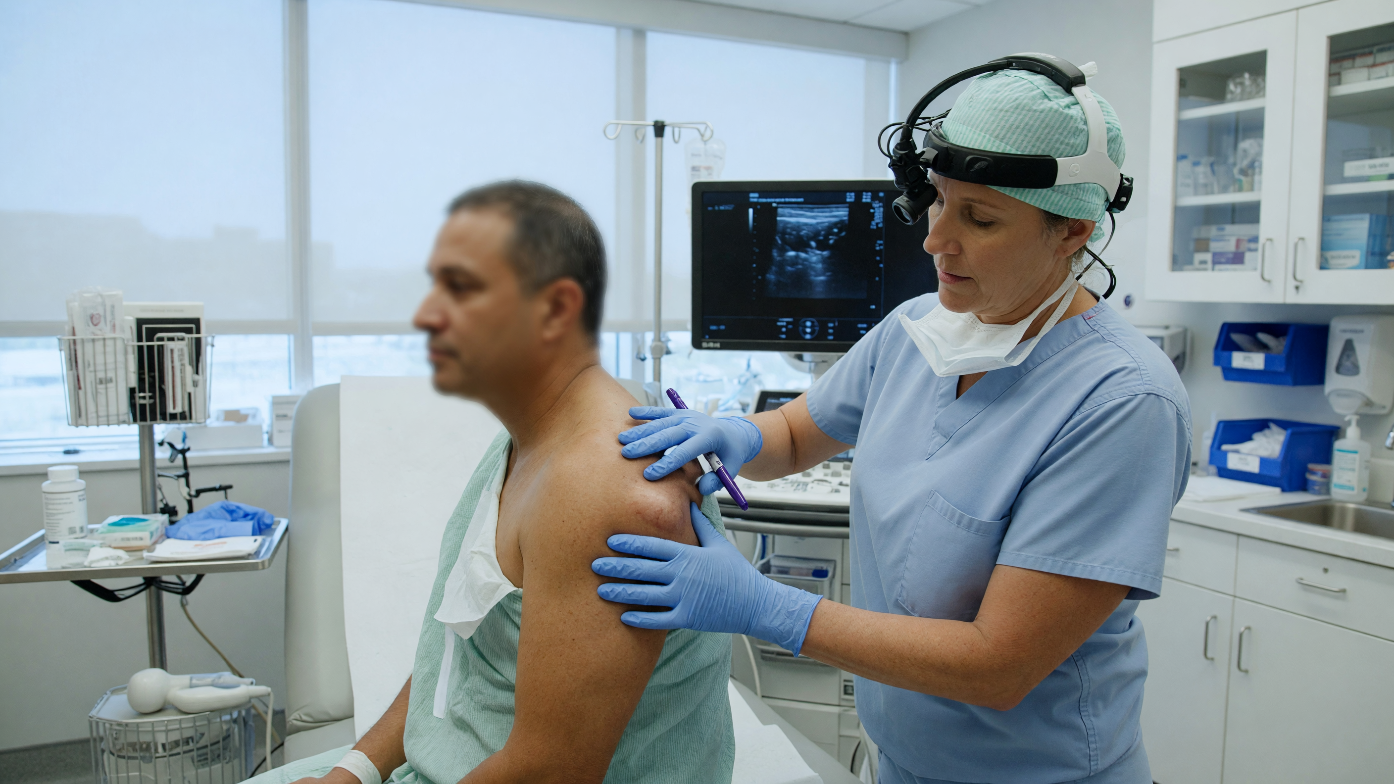 Surgeon examining a soft fatty lump to decide if lipoma removal is needed