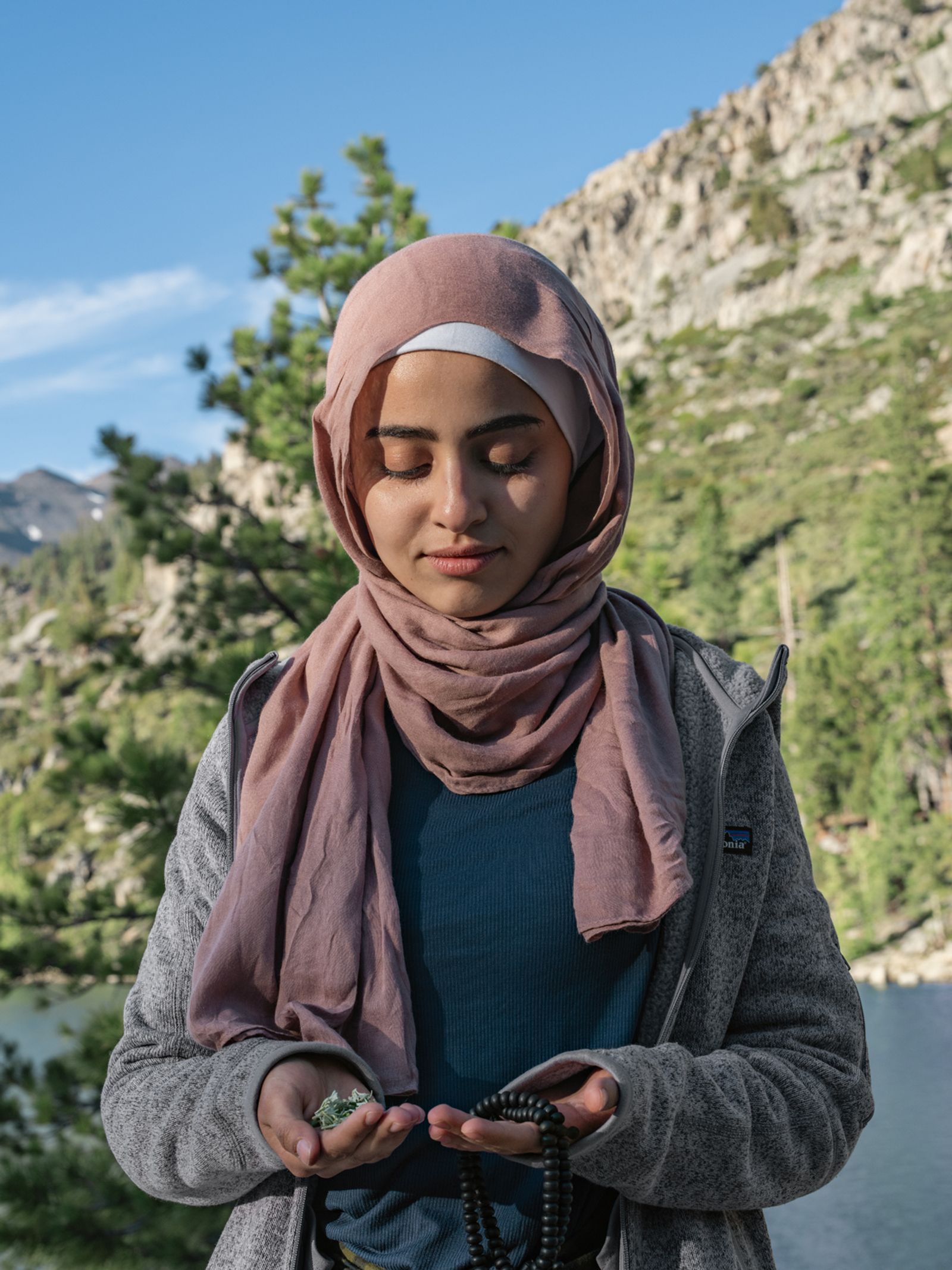 ​​Khadidja Fares Holding Sage and Prayer Beads, California 2019