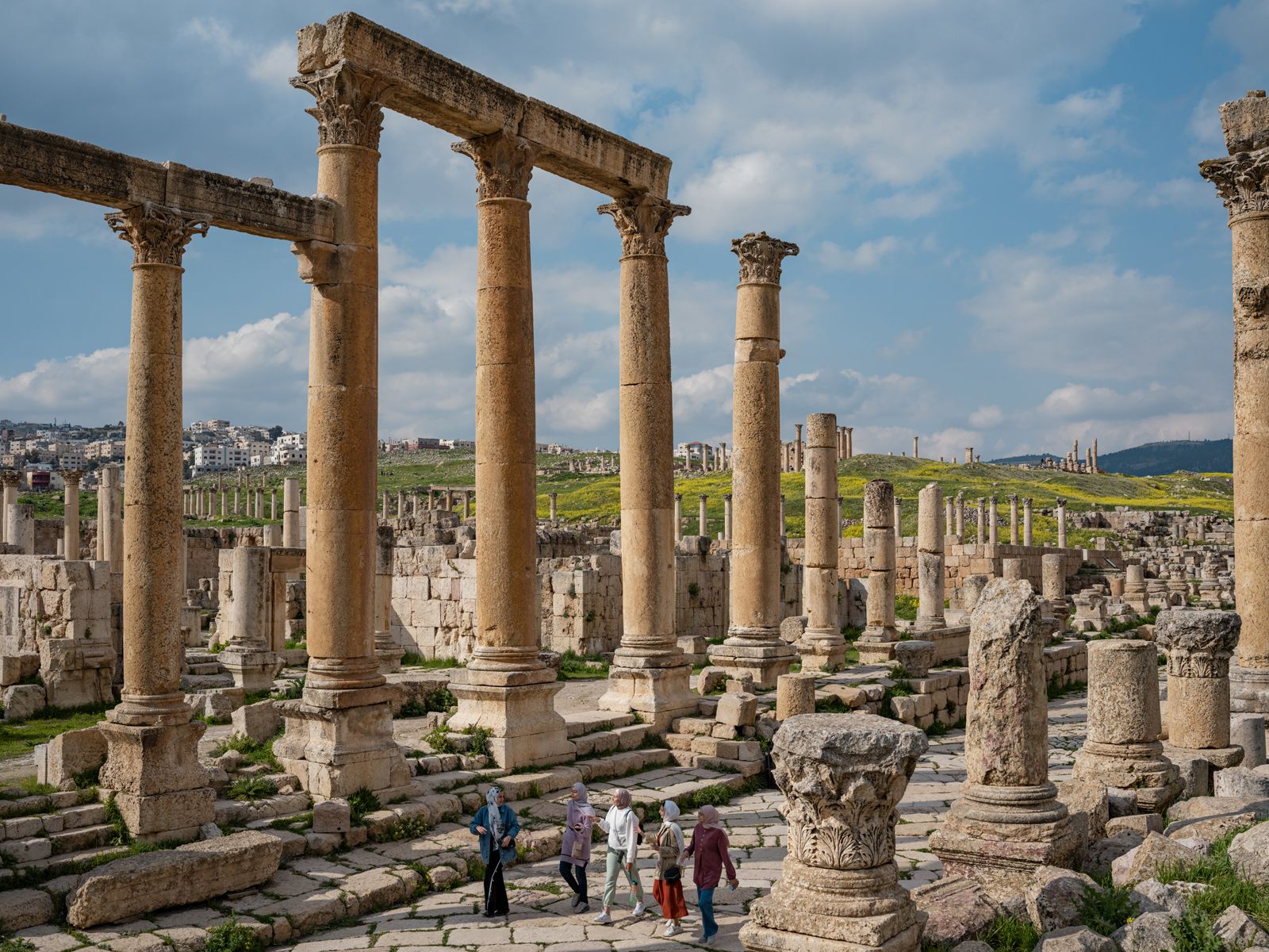 Ghina, Raghad, Yusra, Nahla, and Rahaf Walking through Roman Ruins after Leaving Palestine, Jordan, 2022