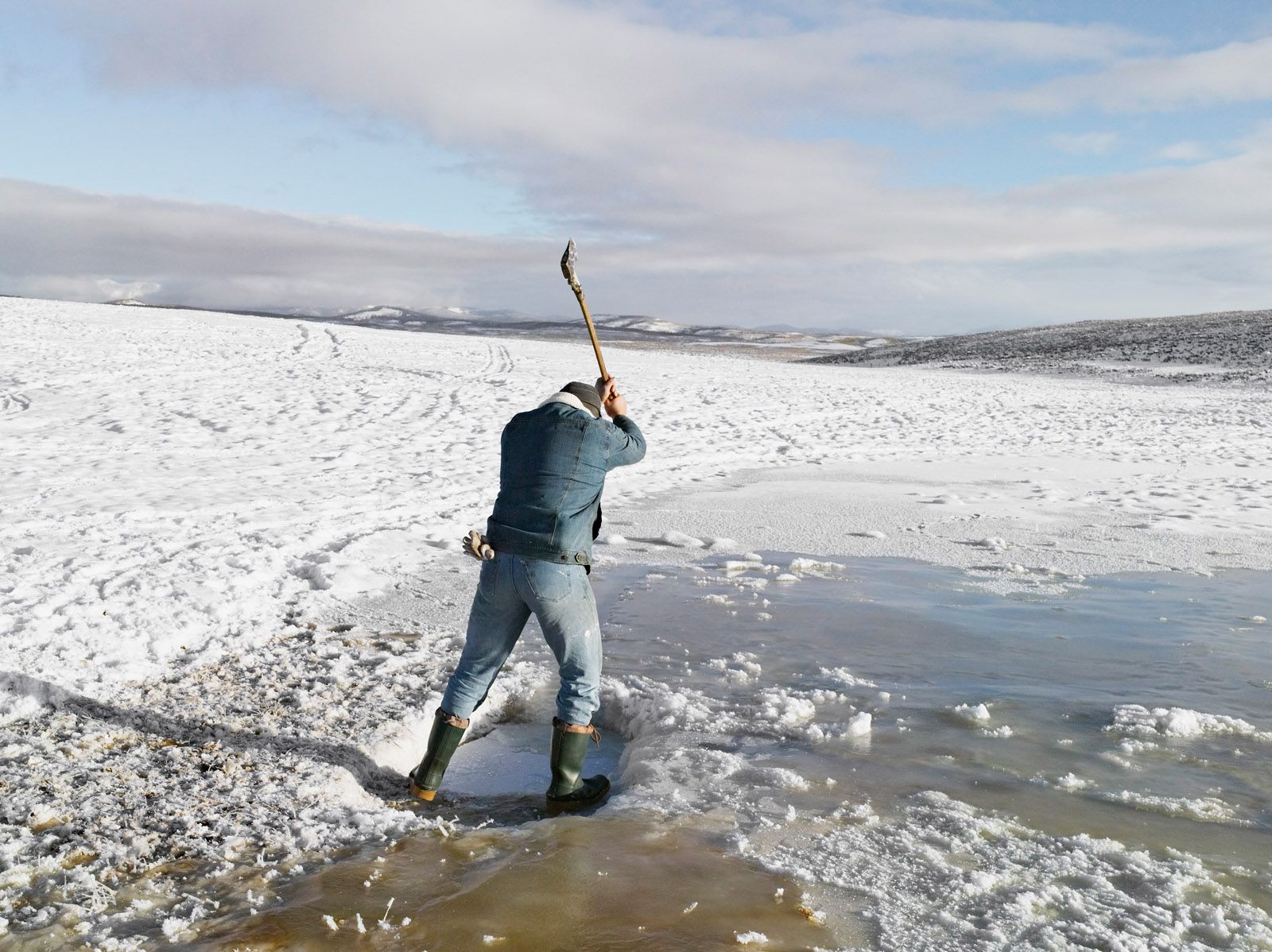 Herman Getting Water for Cattle, Siems Ranch, Merna, Wyoming 2010