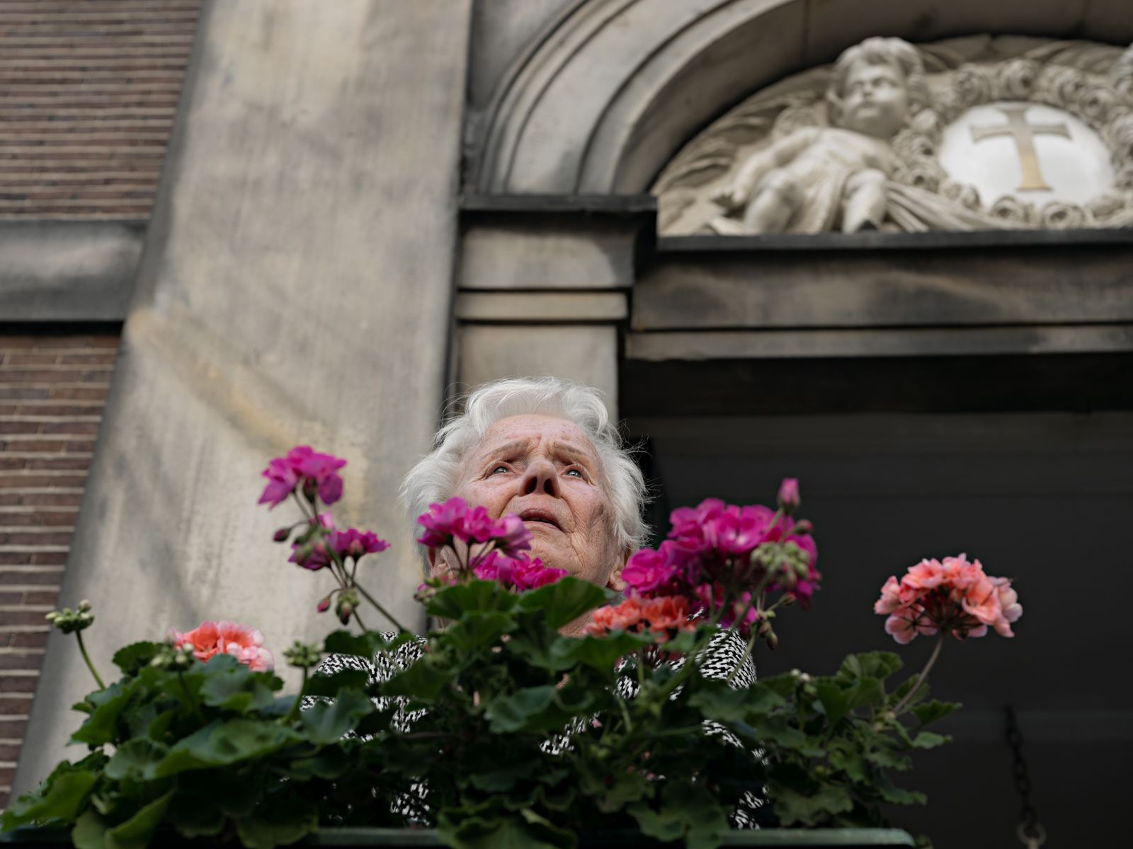 Ida Tending Her Geraniums, the Netherlands, 2022