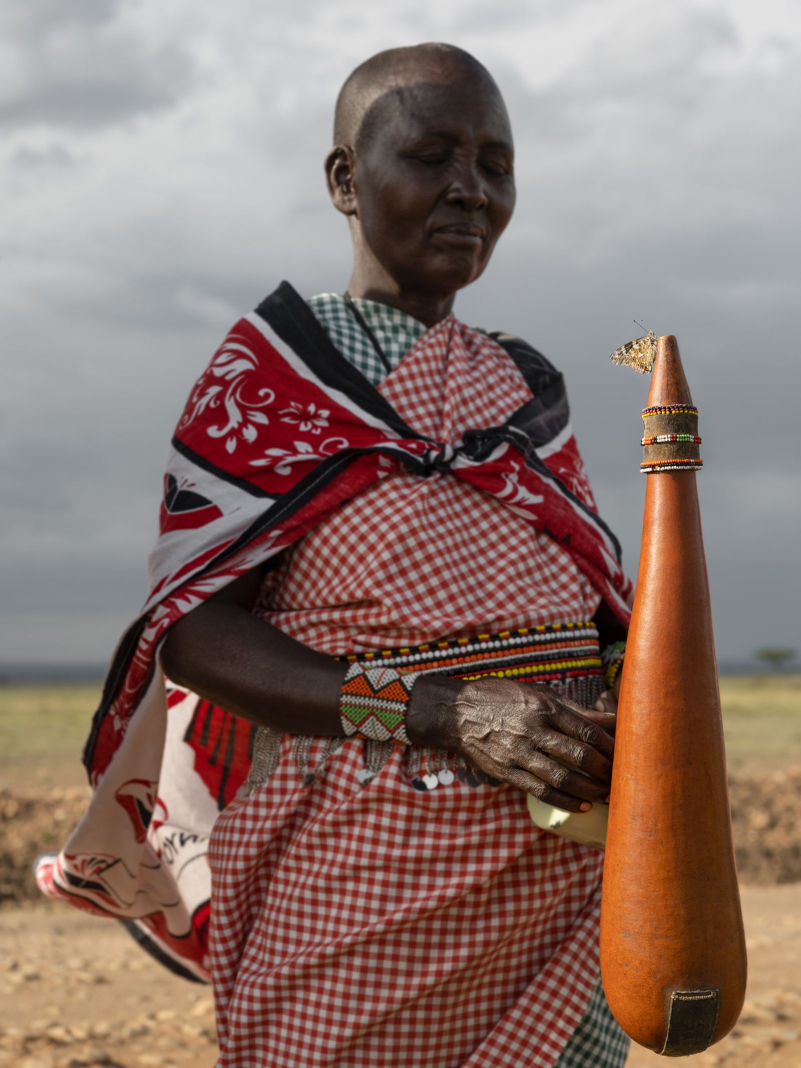 Naitoti with a Painted Lady Butterfly on Her Milk Gourd, Kenya, 2021